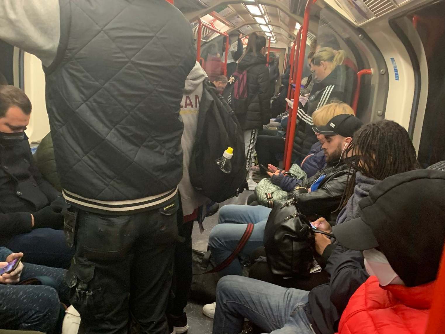 Handout photo taken with permission from the Twitter feed of @ajadmiah2 showing a carriage on the Central Line packed with commuters