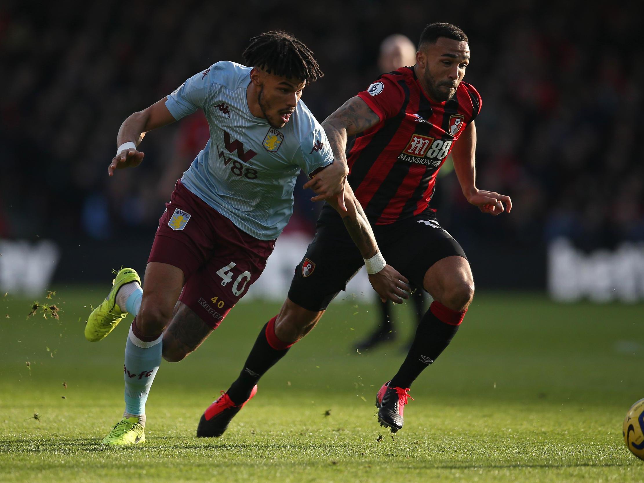 Tyrone Mings of Aston Villa battles for possession with Callum Wilson of AFC Bournemouth