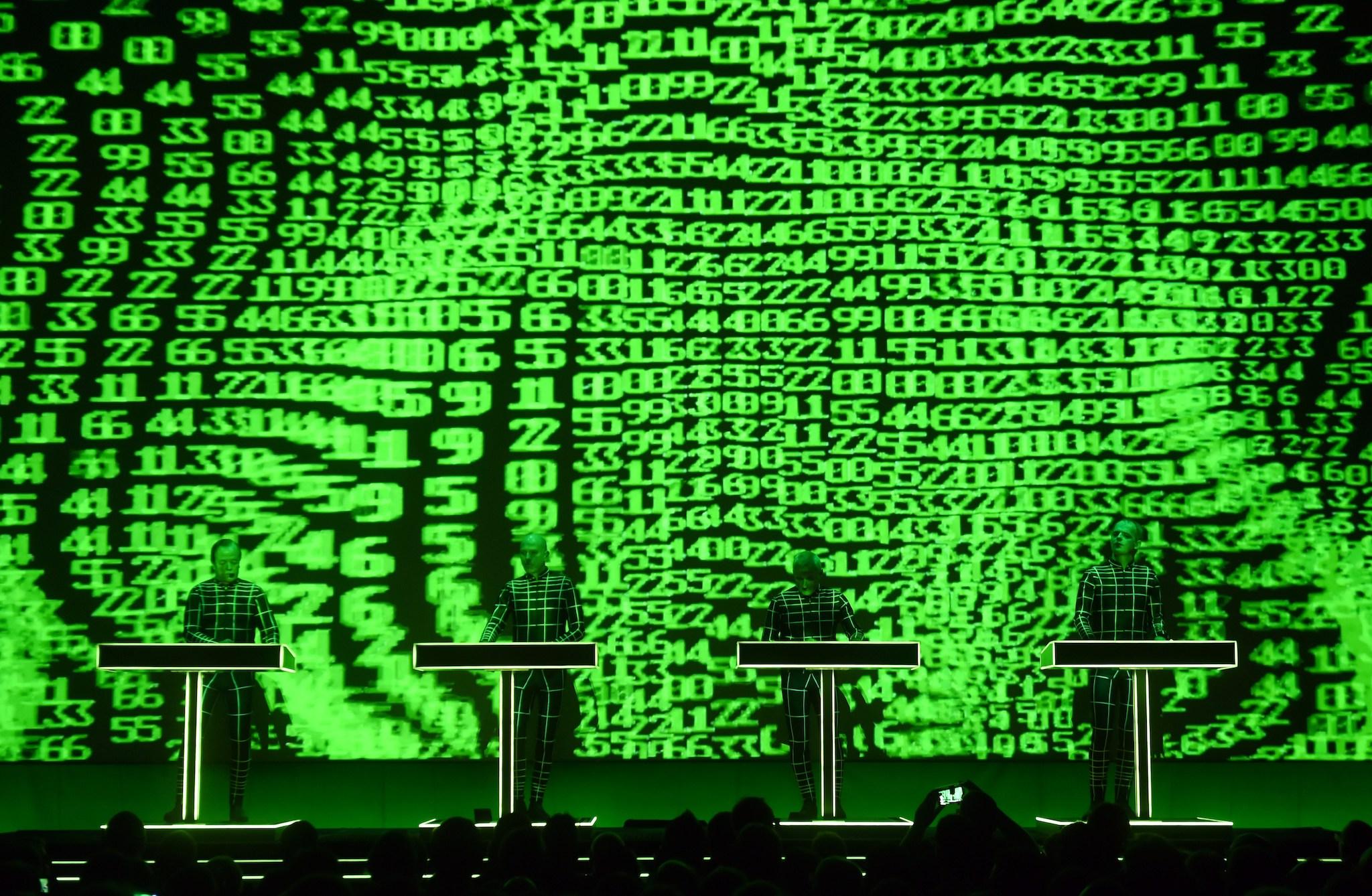 German electronic music band Kraftwerk ("power station") performs in front of a 3D video installation