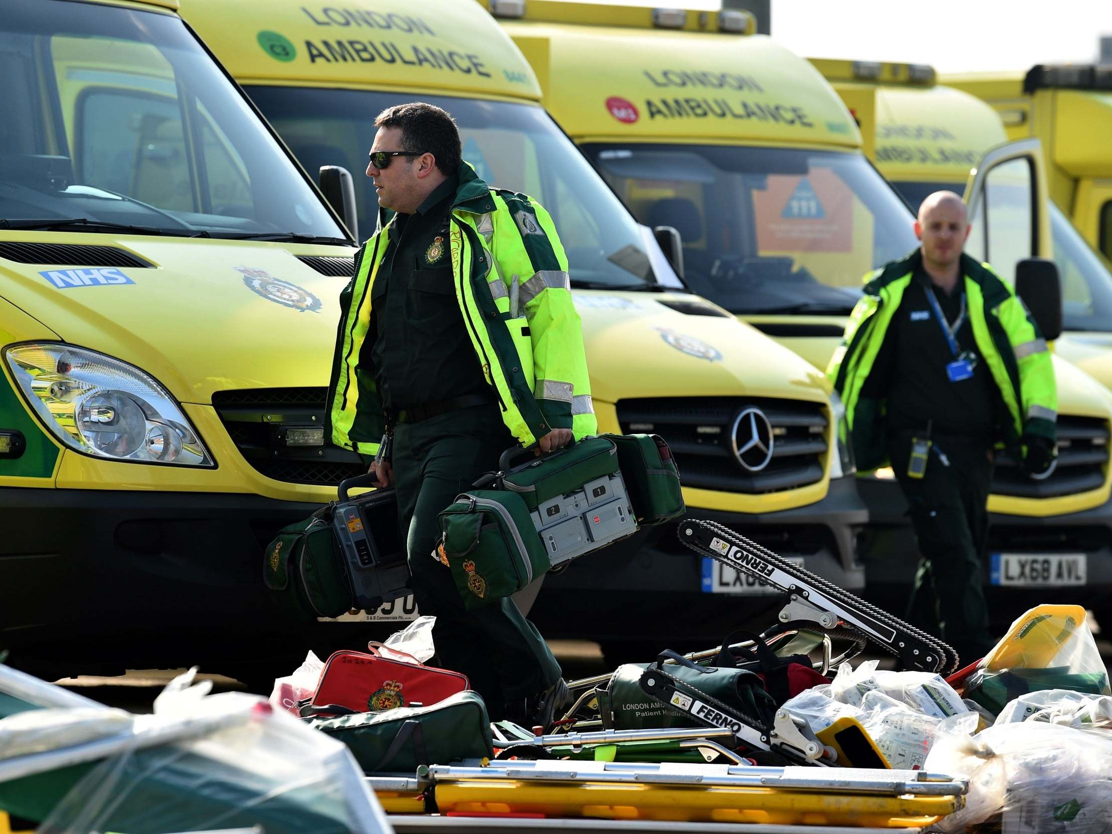 Staff prepare to load equipment at the ExCeL London exhibition centre that is being transformed into the NHS Nightingale Hospital