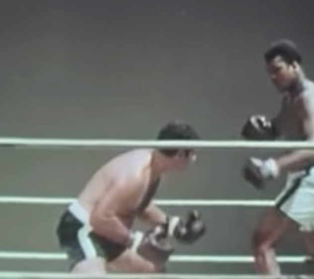 Muhammad Ali and Rocky Marciano act out their fight in the gym