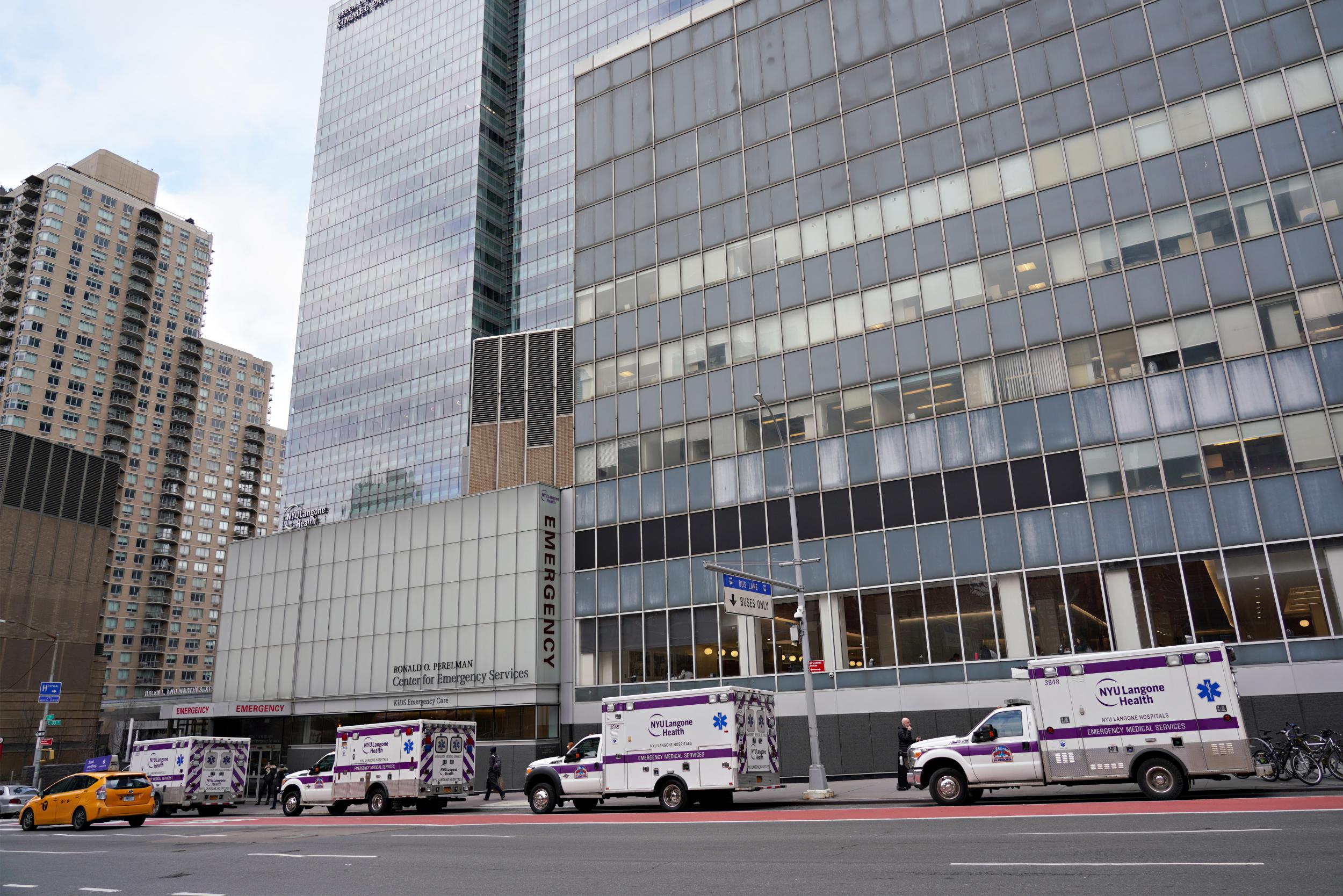 Ambulances are parked in front of the NYU Langone Health emergency as coronavirus continues to spread across the city