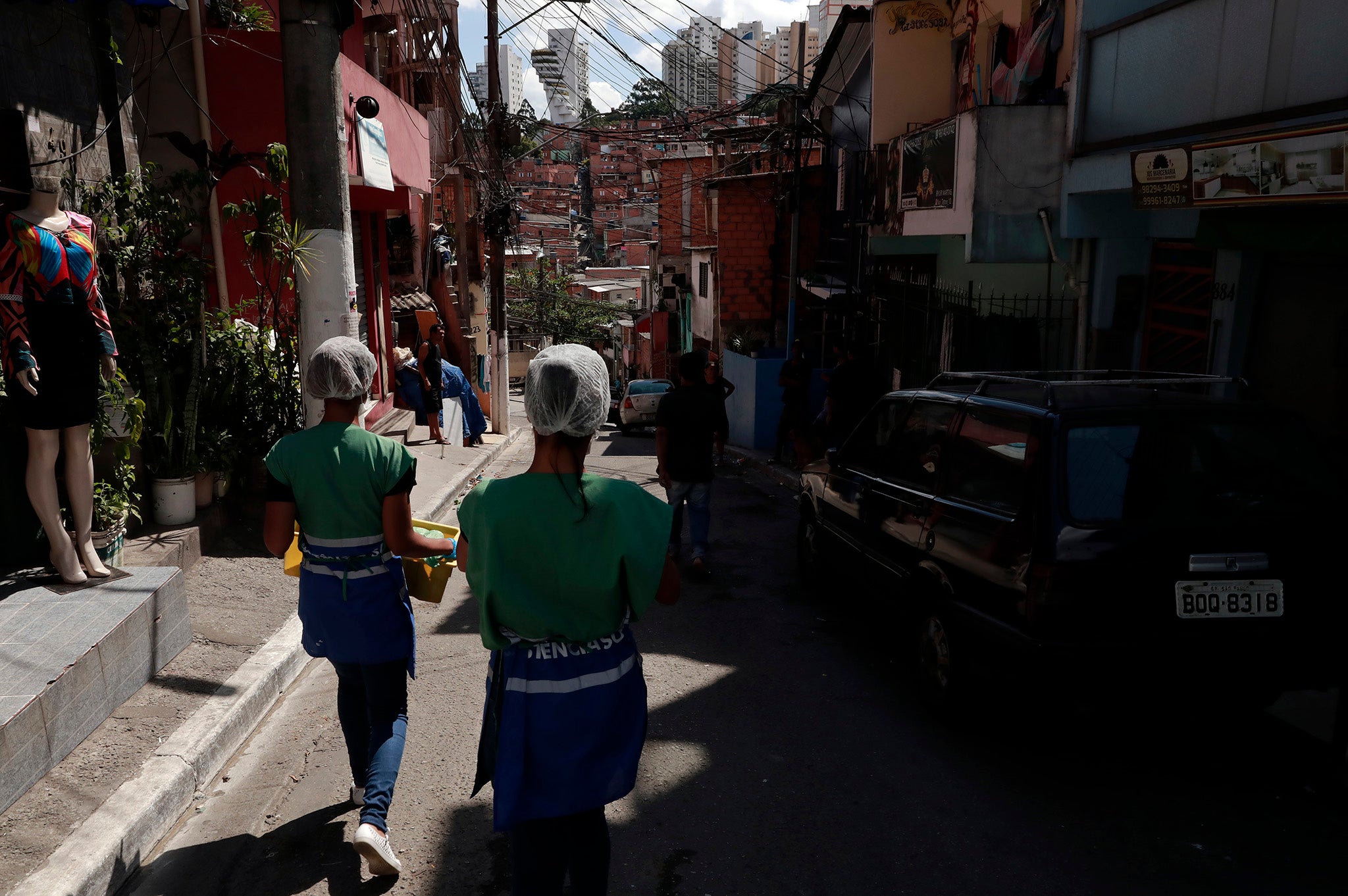 Volunteers deliever food to residents in Sao Paulo