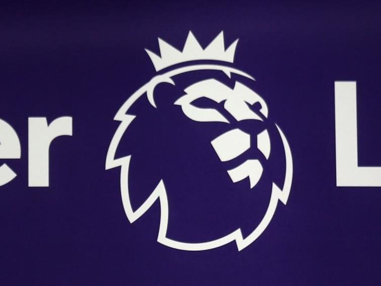 The Premier League logo is pictured through a glass window