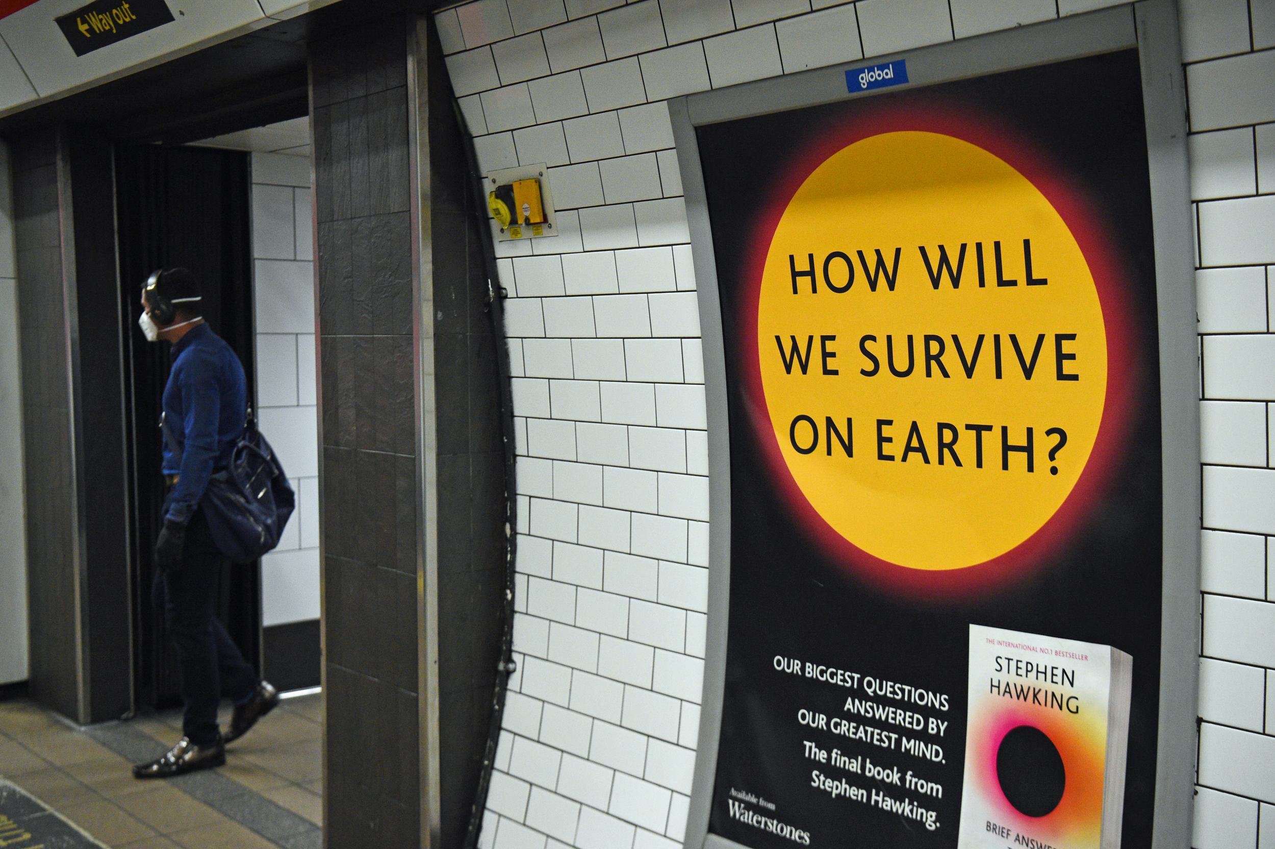 A poster promoting a book by Stephen Hawking on a passageway in London's Oxford Street Underground station the day after Prime Minister Boris Johnson put the UK in lockdown to help curb the spread of the coronavirus. (Kirsty O&amp;#039;Connor/PA Wire/PA Images)