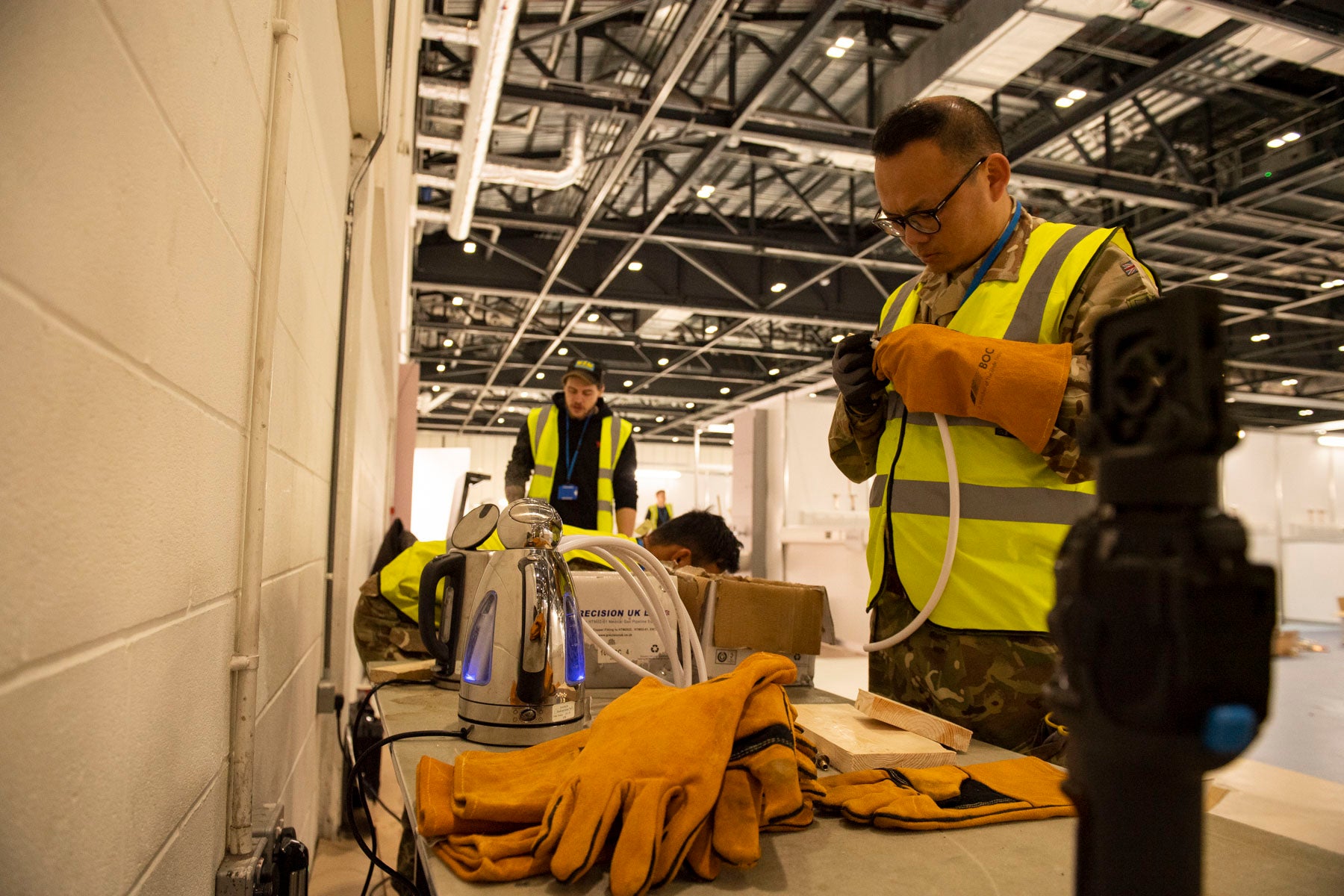 Contractors and military work together as they help set up NHS Nightingale.