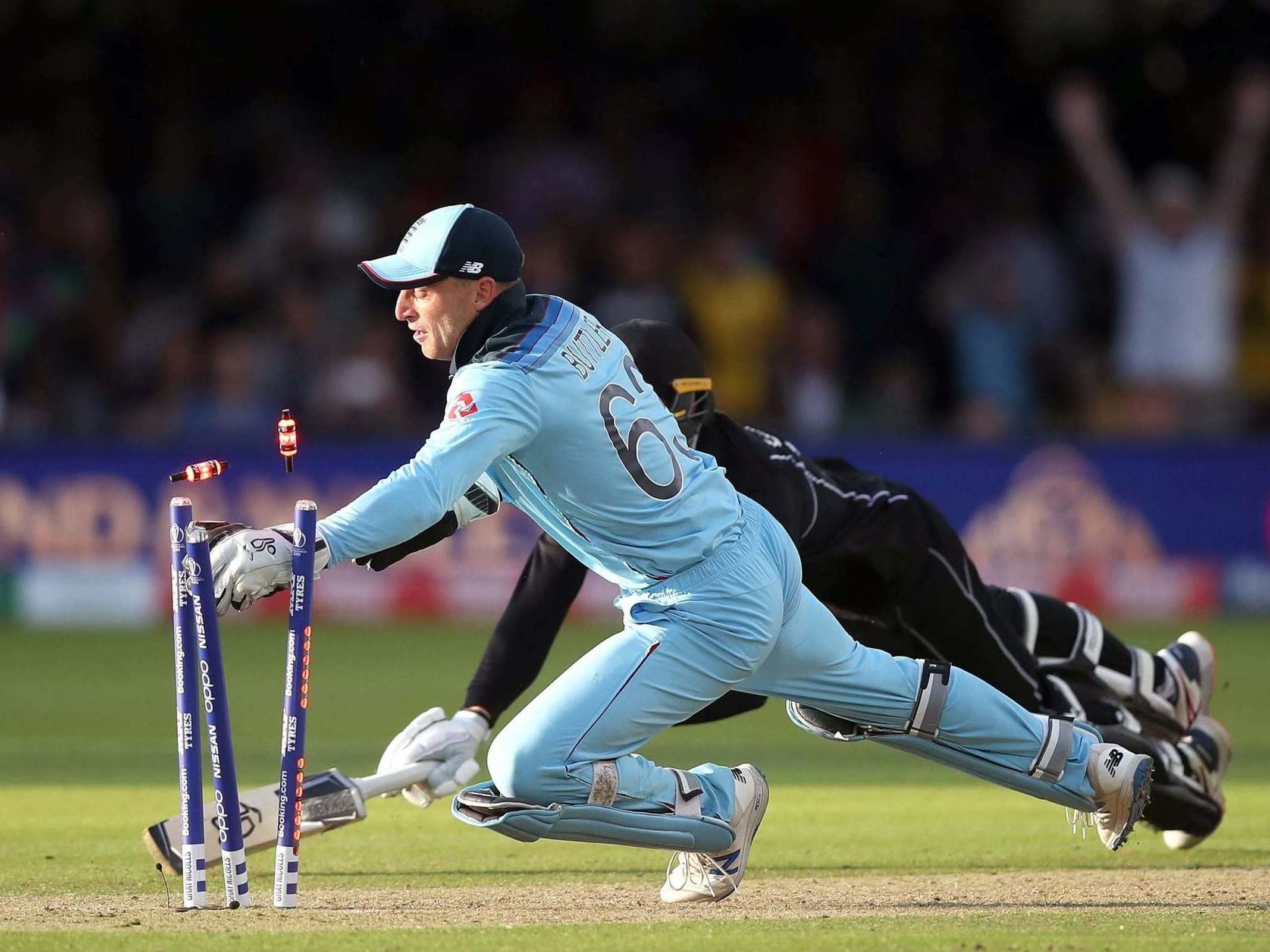 Jos Buttler breaking the bails to clinch England’s World Cup win