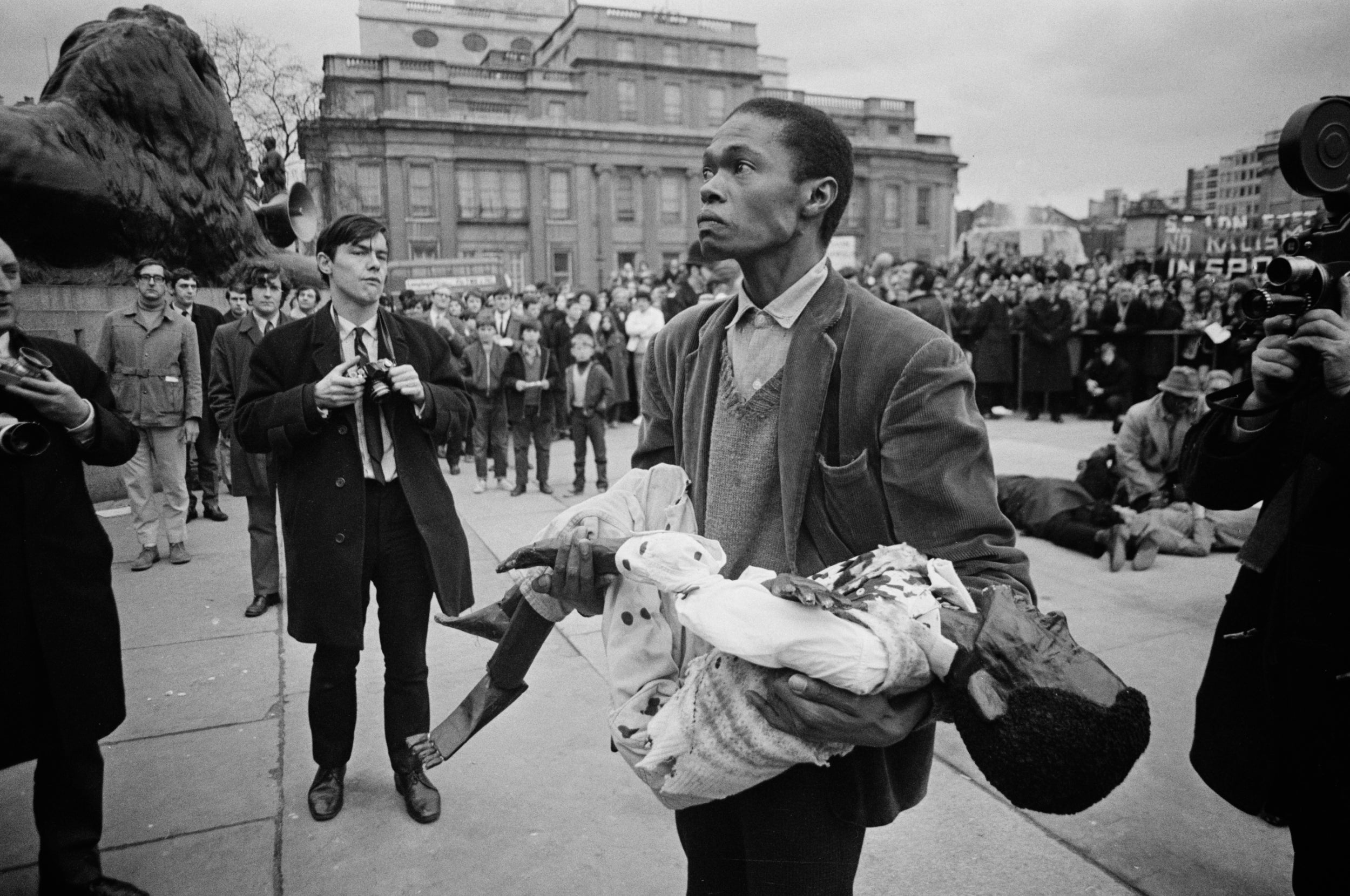 The British Anti-Apartheid Movement marks the tenth anniversary of the massacre with a re-enactment in Trafalgar Square