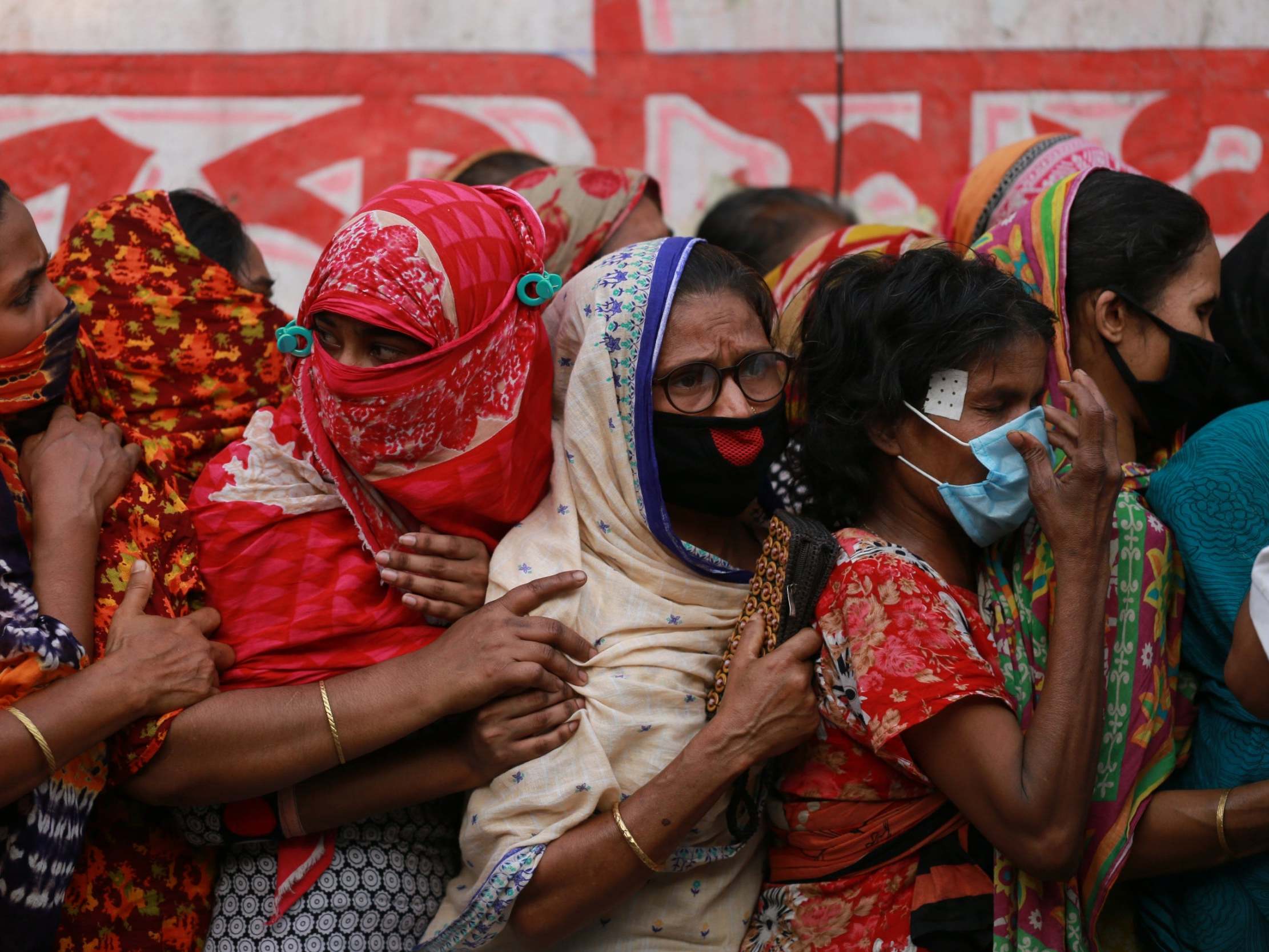 People queue for aid during the lockdown in Bangladesh