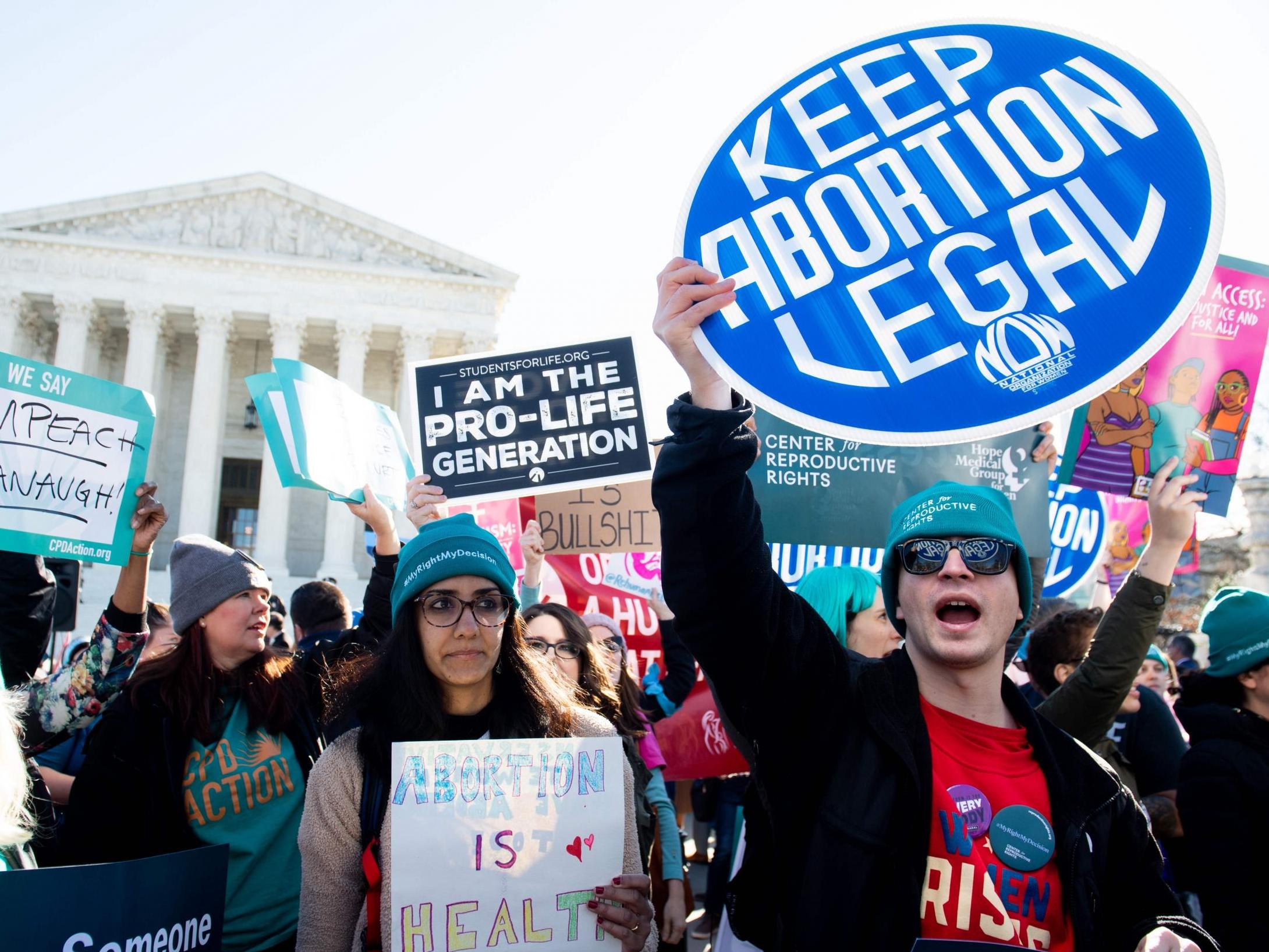 Pro-choice activists protest outside the Supreme Court in Washington DC