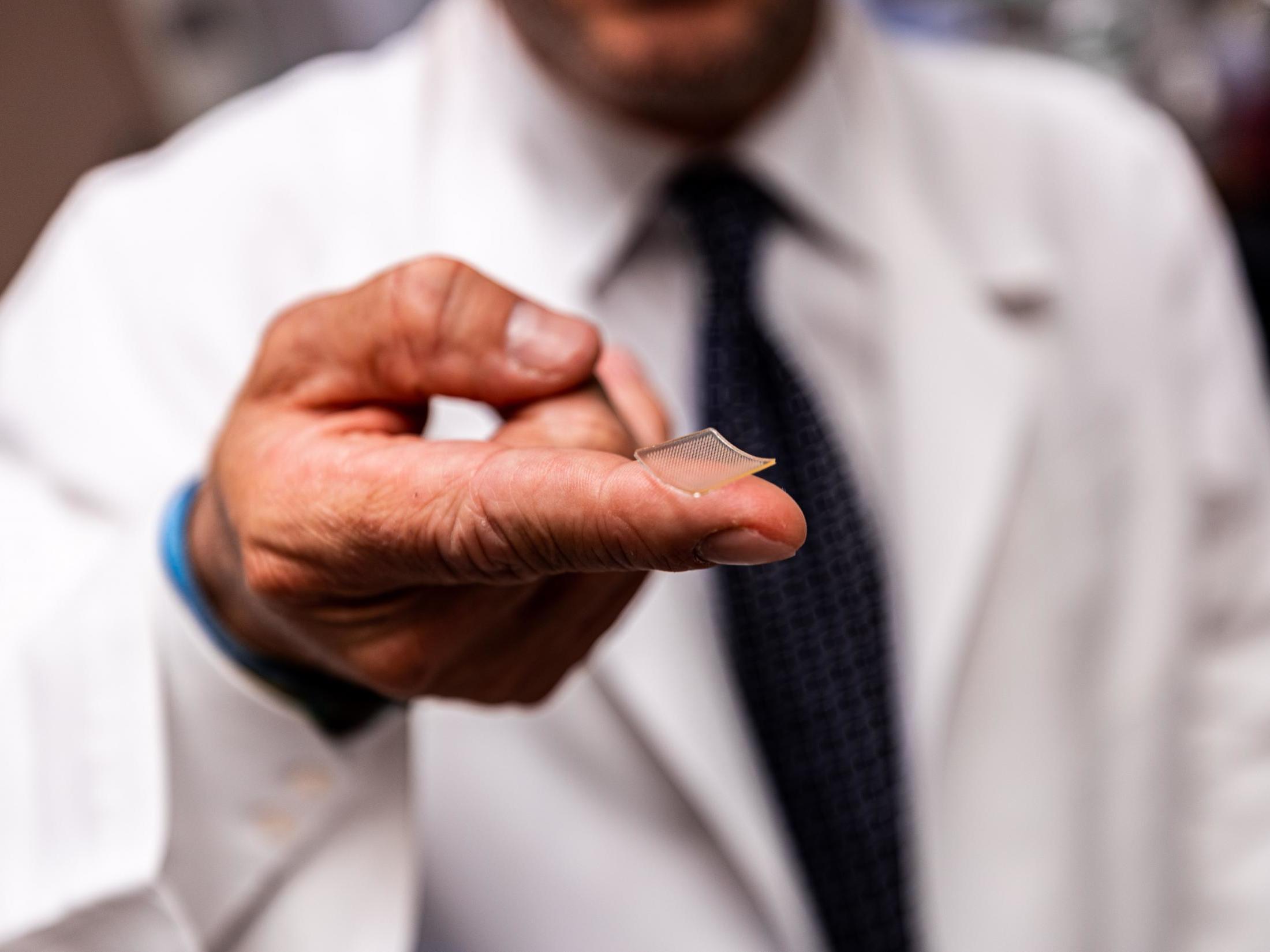 The vaccine is delivered into the skin through a fingertip-sized patch of microscopic needles