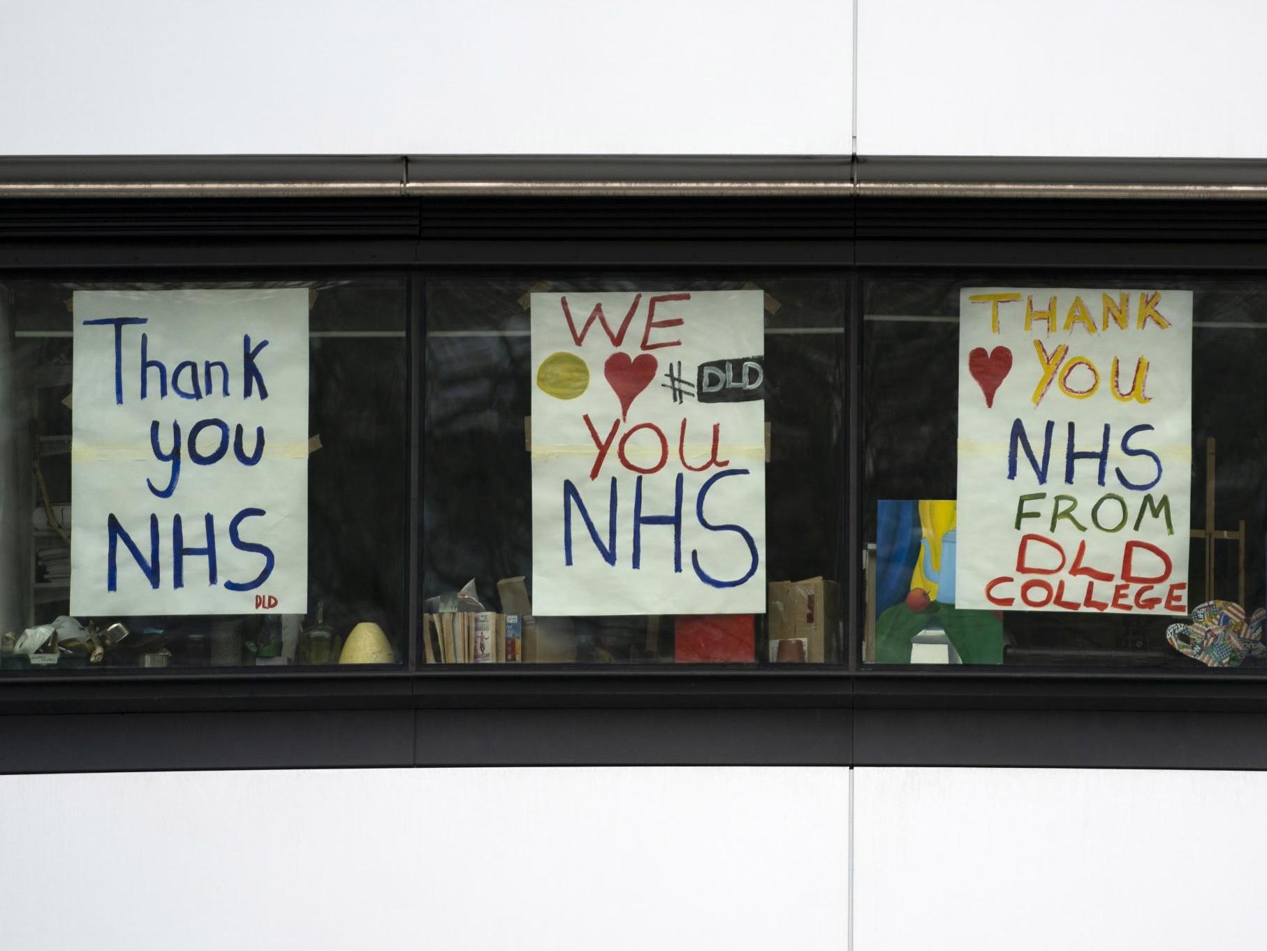 Signs in the windows of DLD College in London