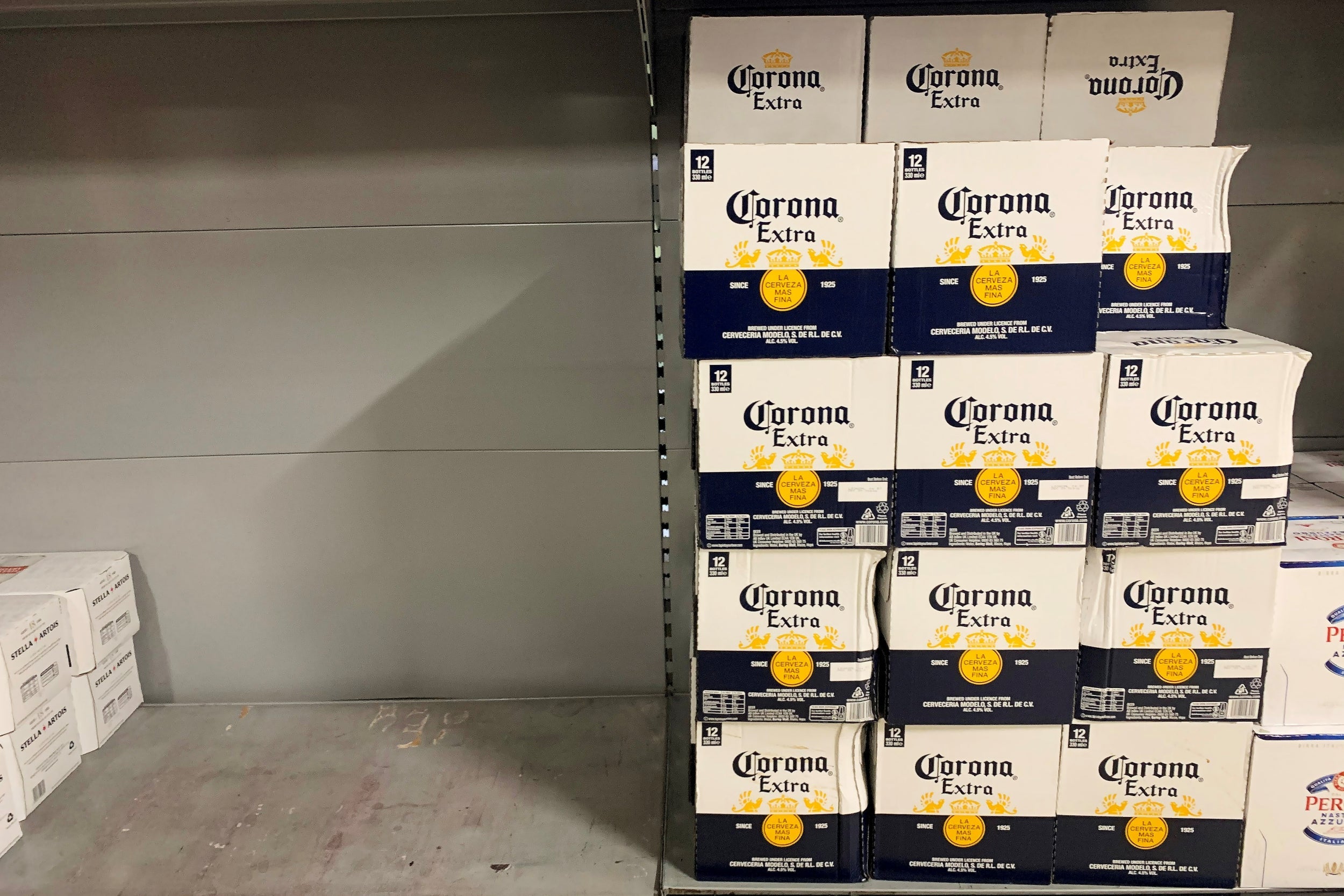 Corona beer left on the shelves at a London supermarket, as the number of coronavirus cases grow around the world