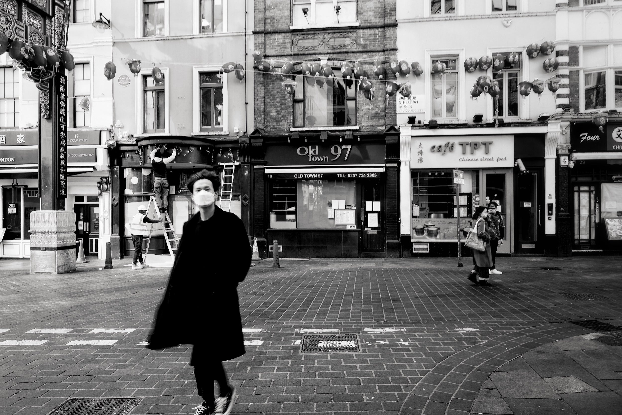 People in masks in Chinatown a day after the lockdown