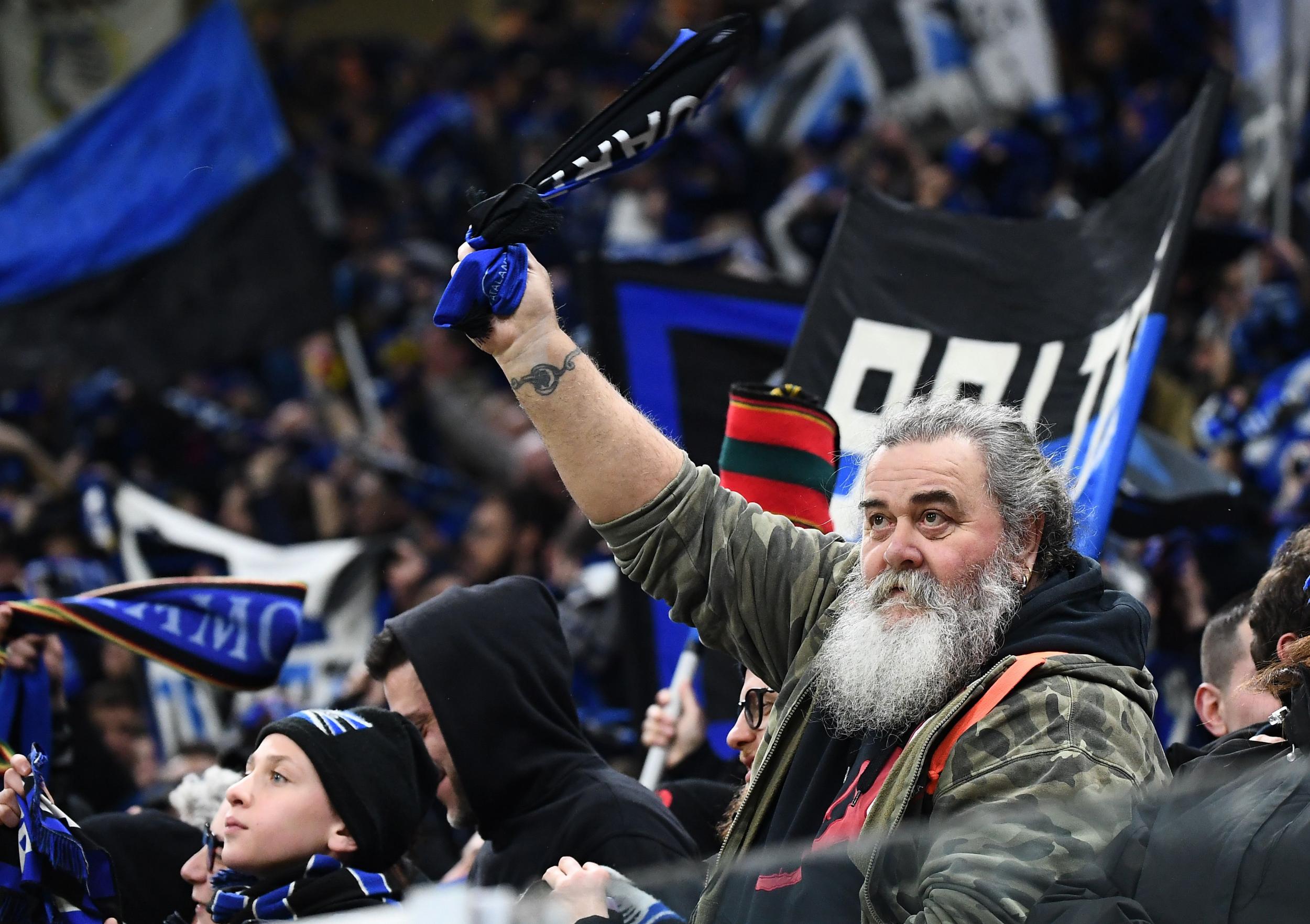 An Atalanta fan watching on at the San Siro