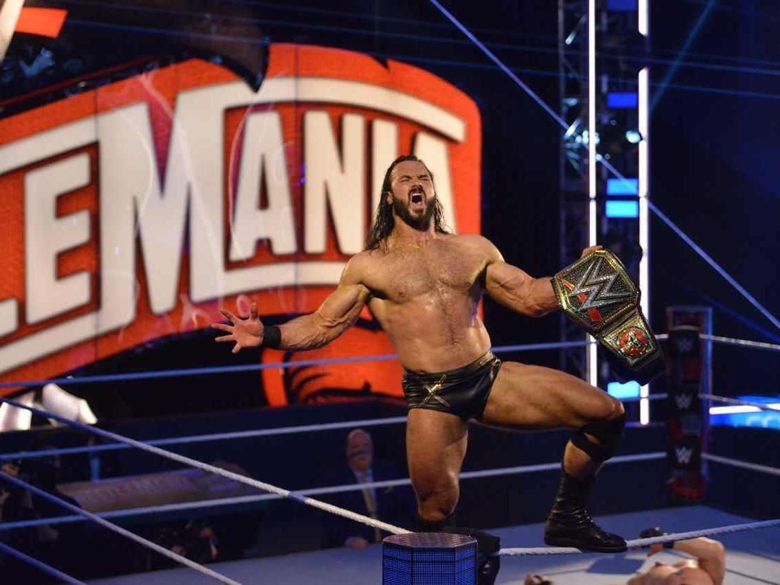 Drew McIntyre celebrates winning the title