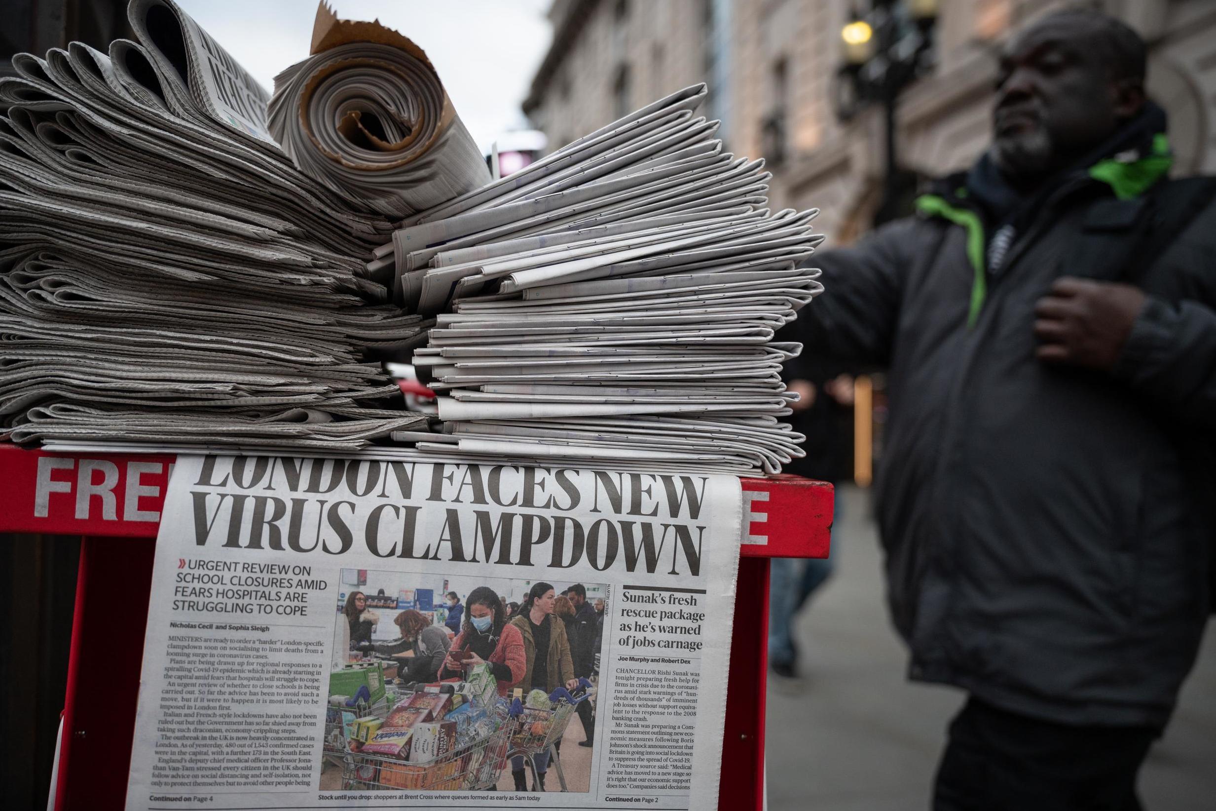 A newspaper headline warns of the potential of further measures to attempt to fight the coronavirus pandemic ahead of the UK lockdown in March (Getty)