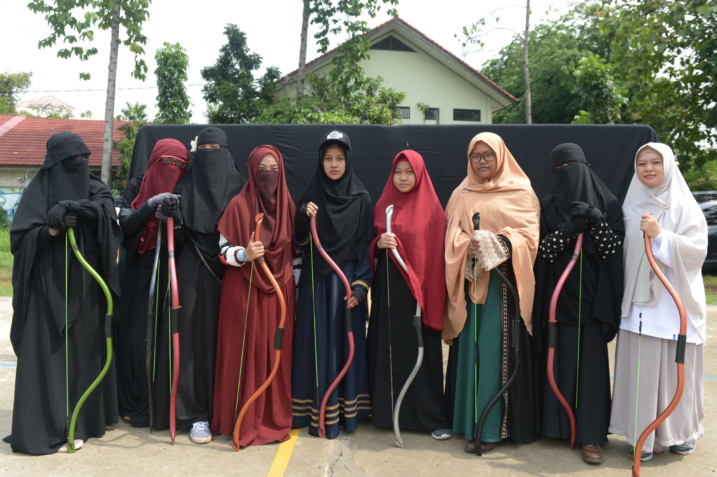 Women pose after their archery and riding lesson in Bekasi