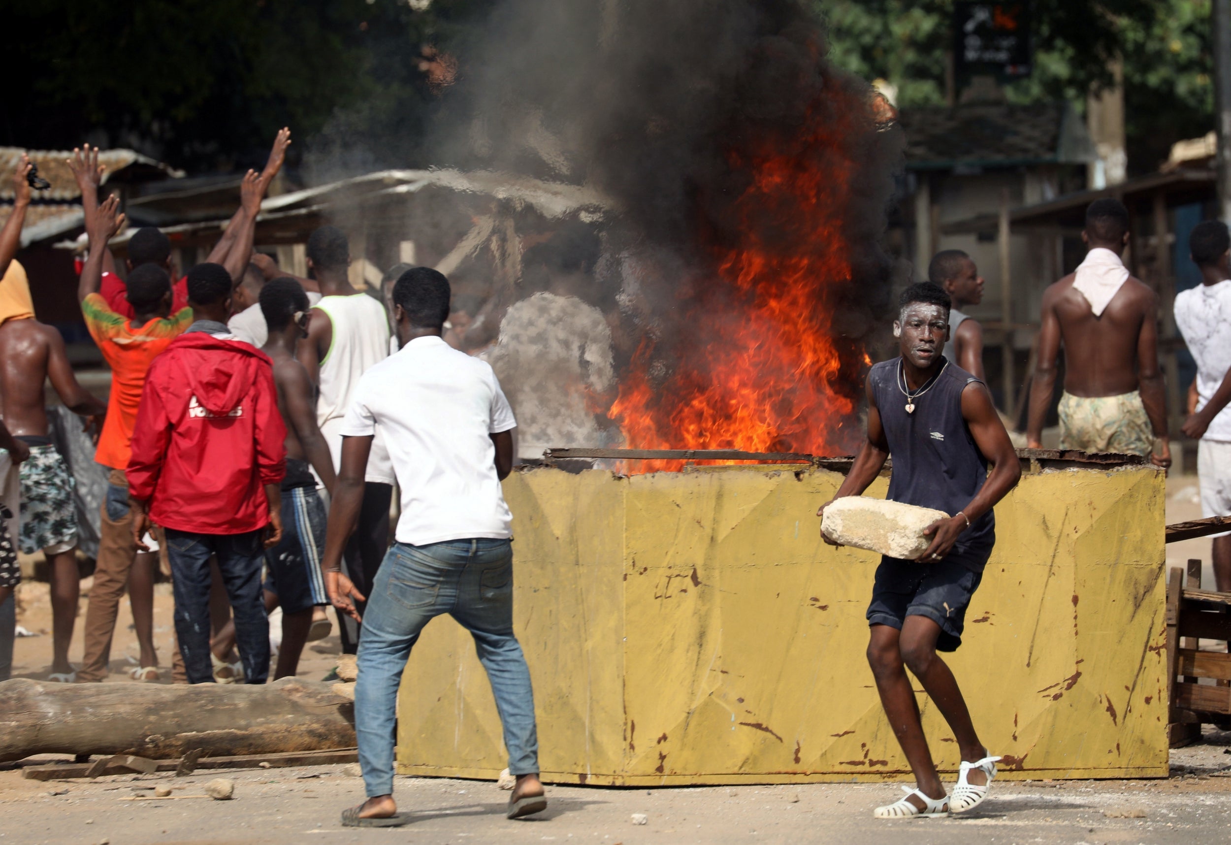 Residents protest after ransacking a half-built makeshift hospital for coronavirus in Ivory coast