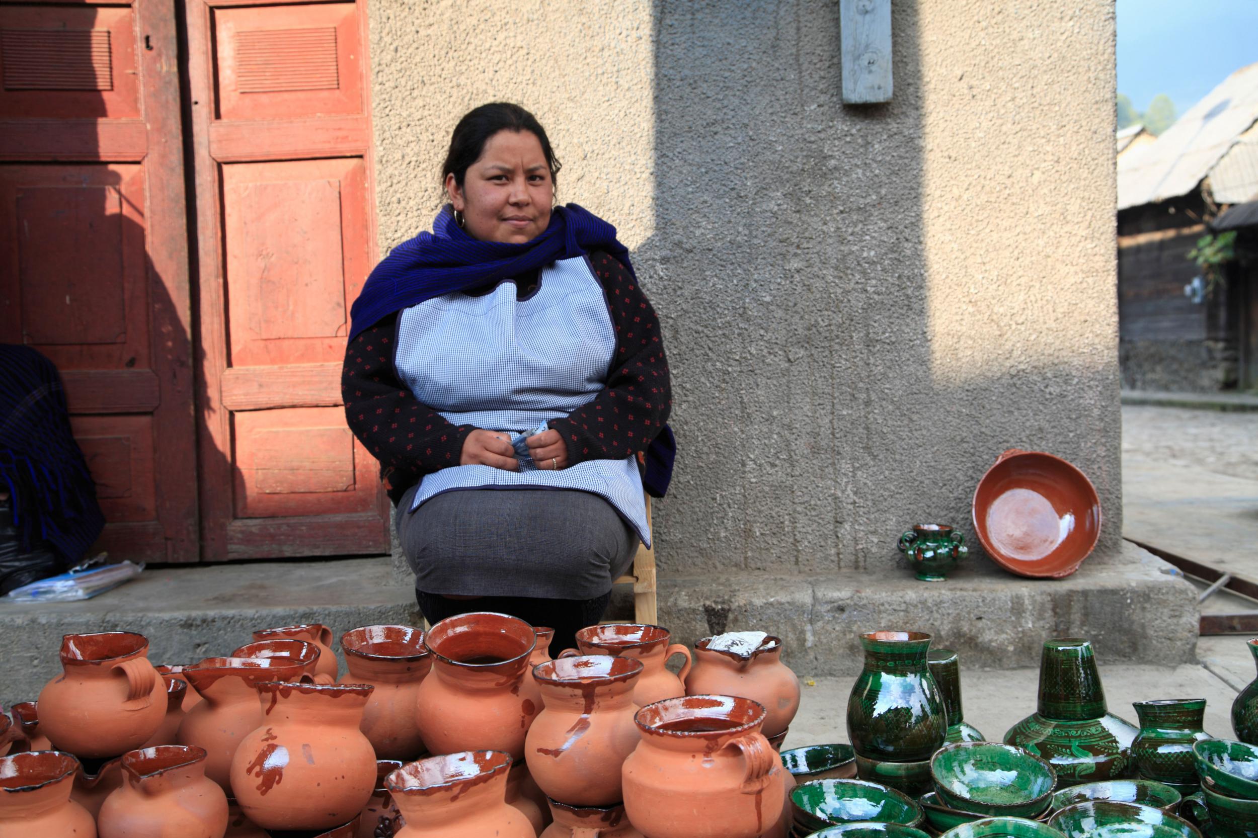 A woman sells pottery in Angahuan