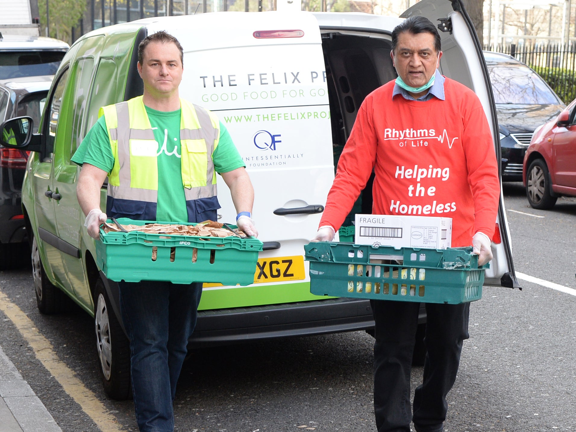 Mark Curtin (left), CEO of Felix Project, and Andrew Faris, founder of Rhythms of Life, deliver food for The Felix Project