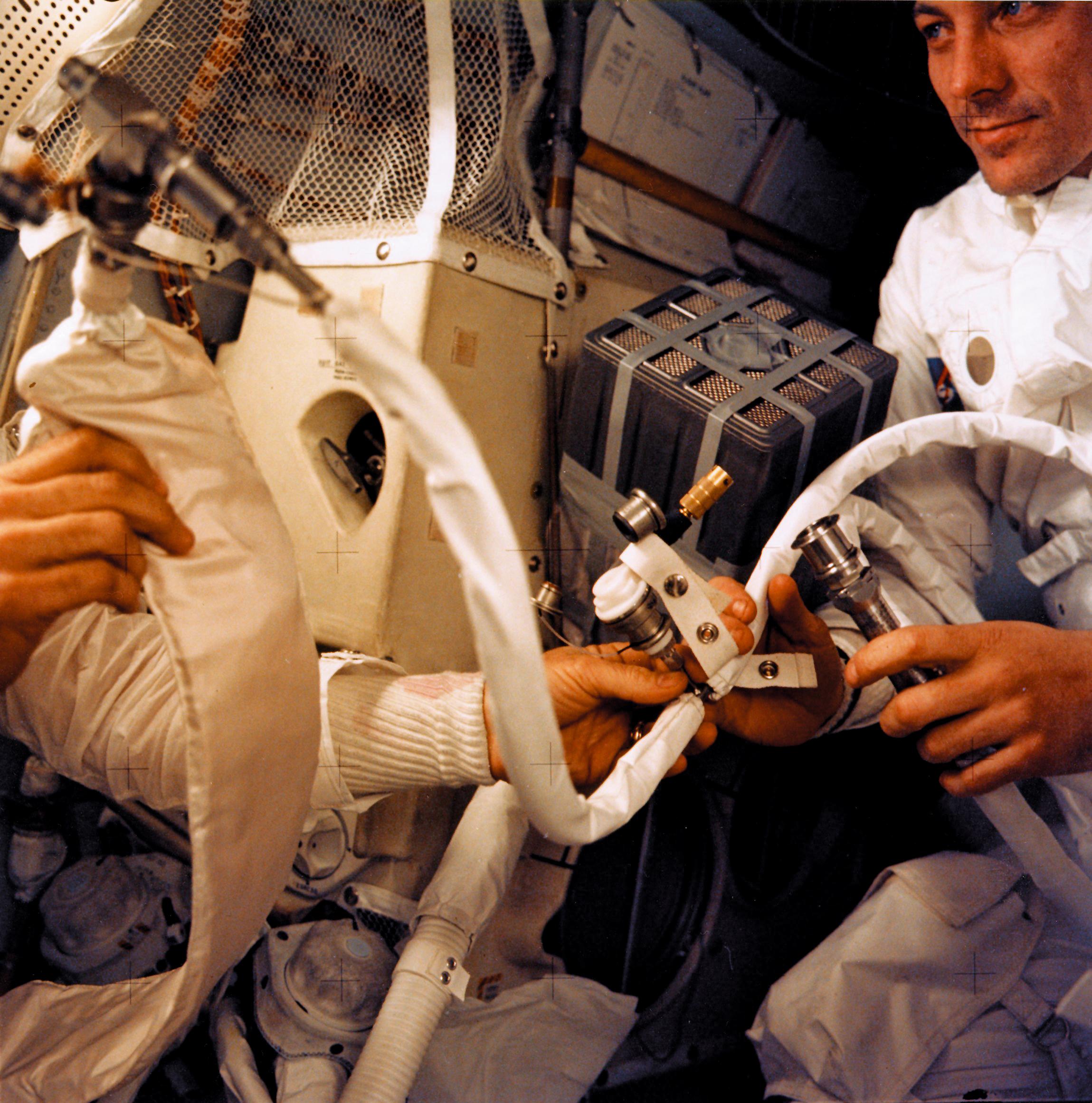 Haise works inside the lunar module after the explosion of the ship’s oxygen tanks