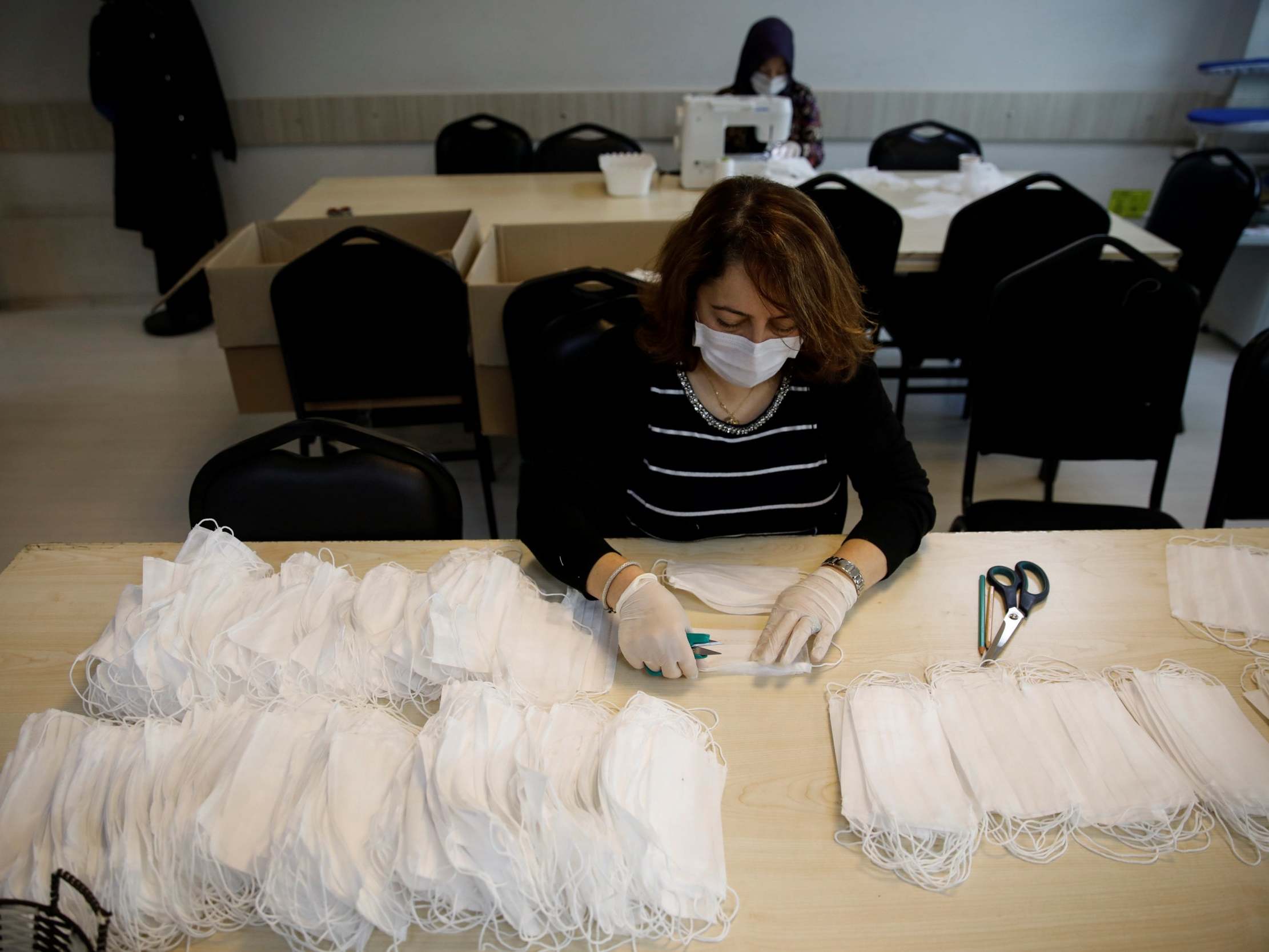 In Istanbul, teachers sew protective face masks in their classrooms to help contain the coronavirus (Reuters)