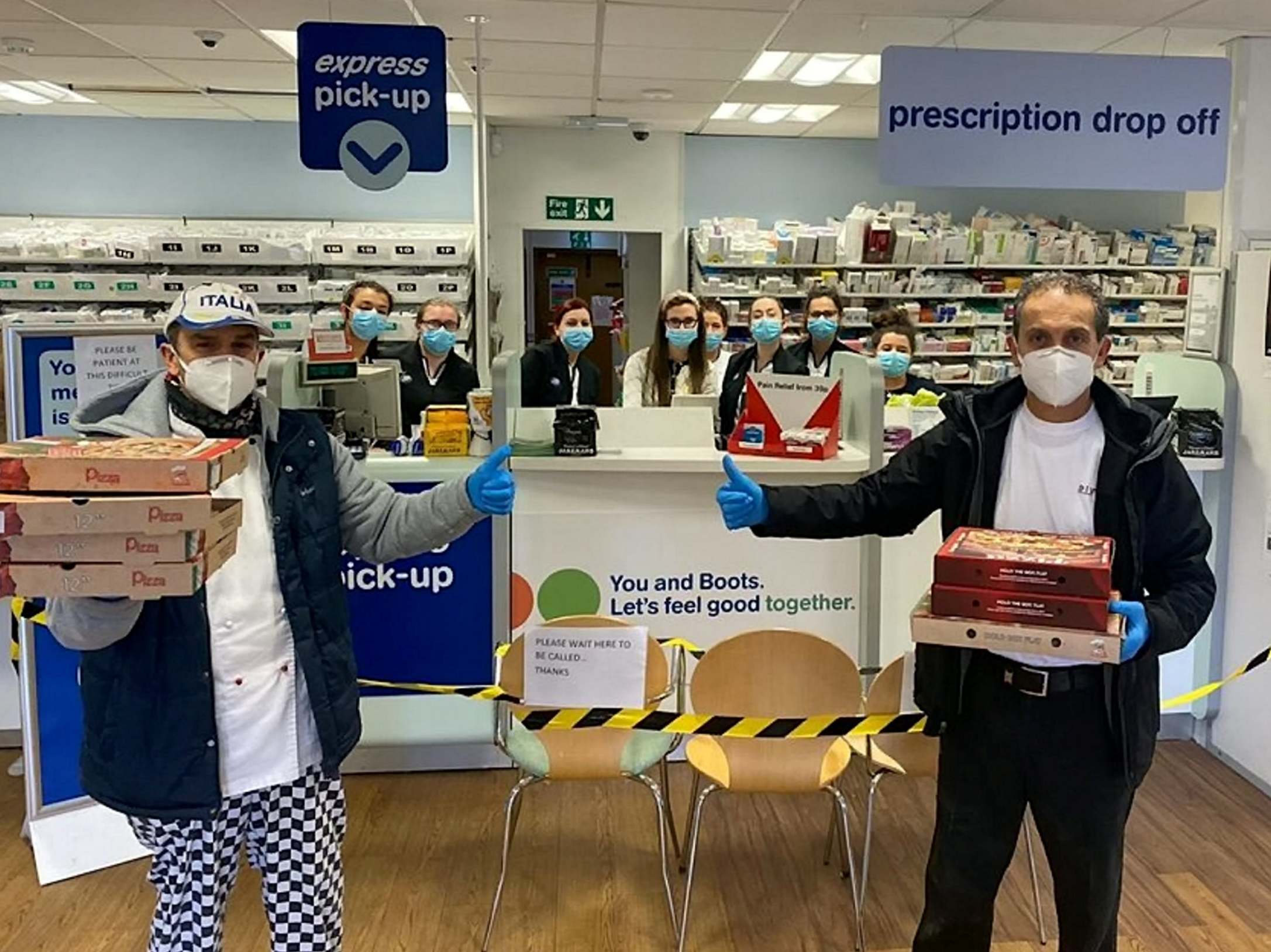 Workers from Di Vitos Chip Shop in Hamilton, South Lanarkshire deliver pizzas to their local chemist