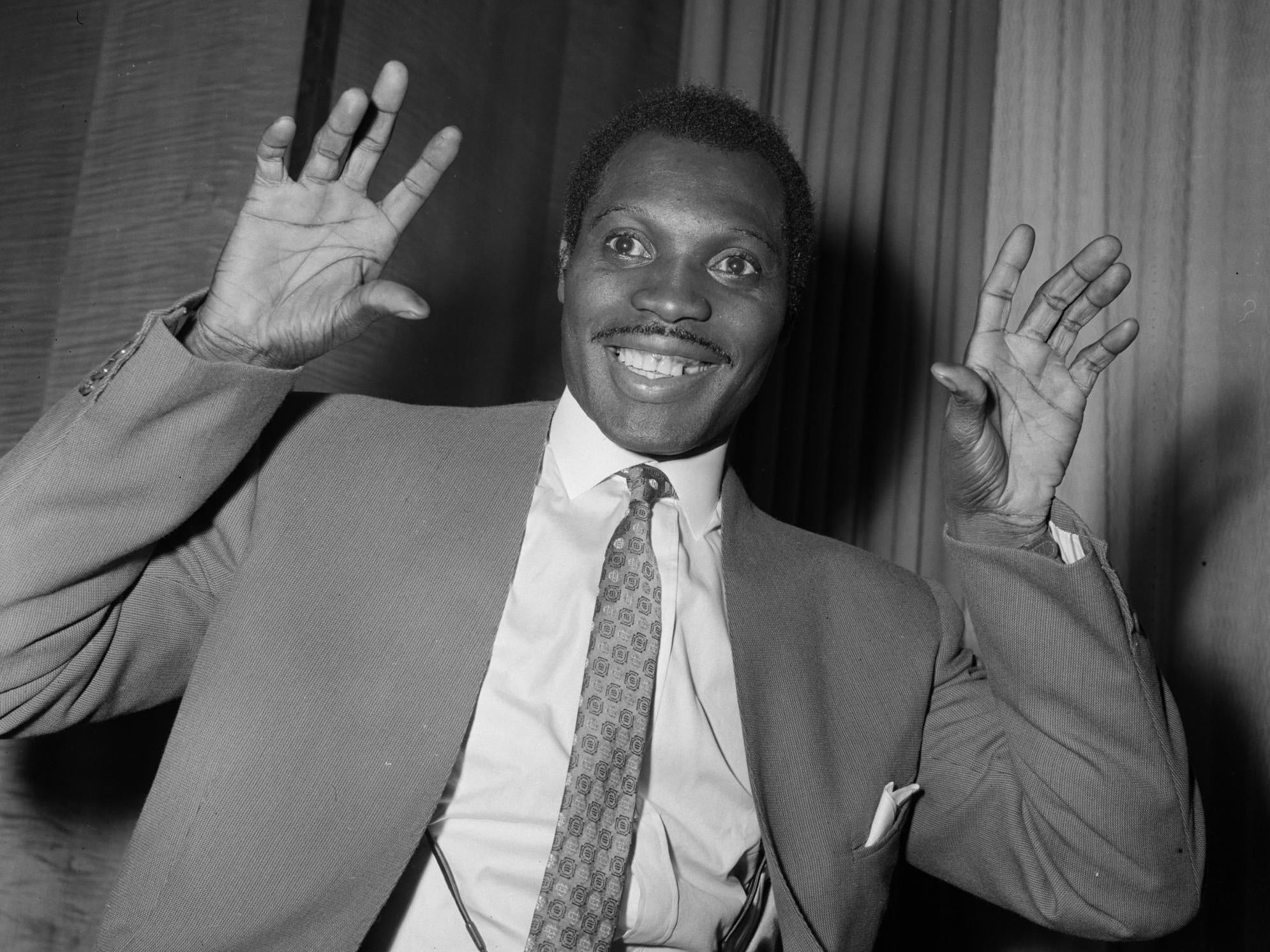 Calypso singer Aldwyn Roberts, known as ‘Lord Kitchener’, at the Savoy Hotel, 1957