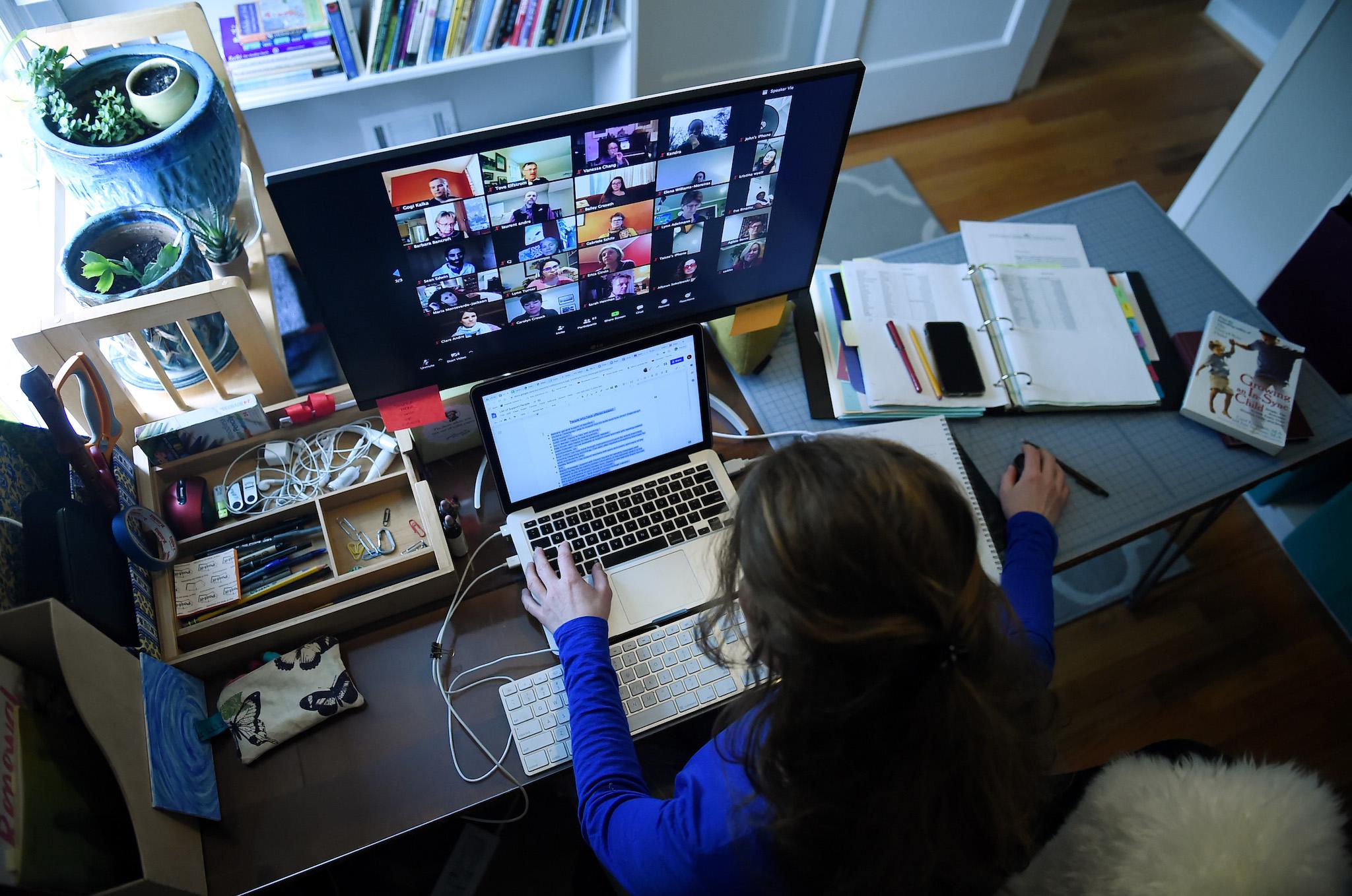 Lauryn Morley, a lower school substitute teacher for the Washington Waldorf School in Bethesda, Maryland, works from her home due to the Coronavirus outbreak, on April 1, 2020 in Arlington, Virginia