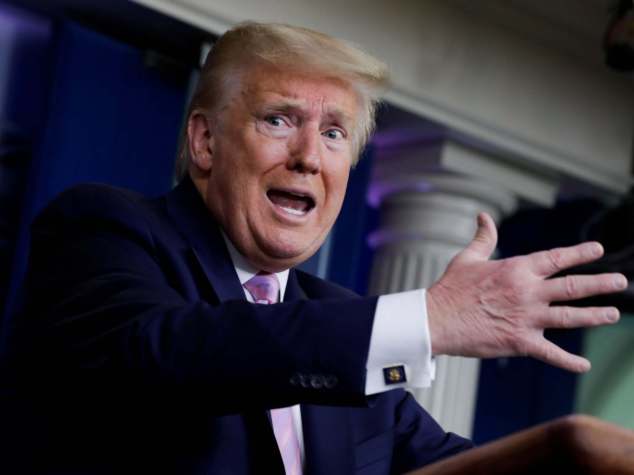 US President Donald Trump talks to journalists during a White House briefing on coronavirus on Friday