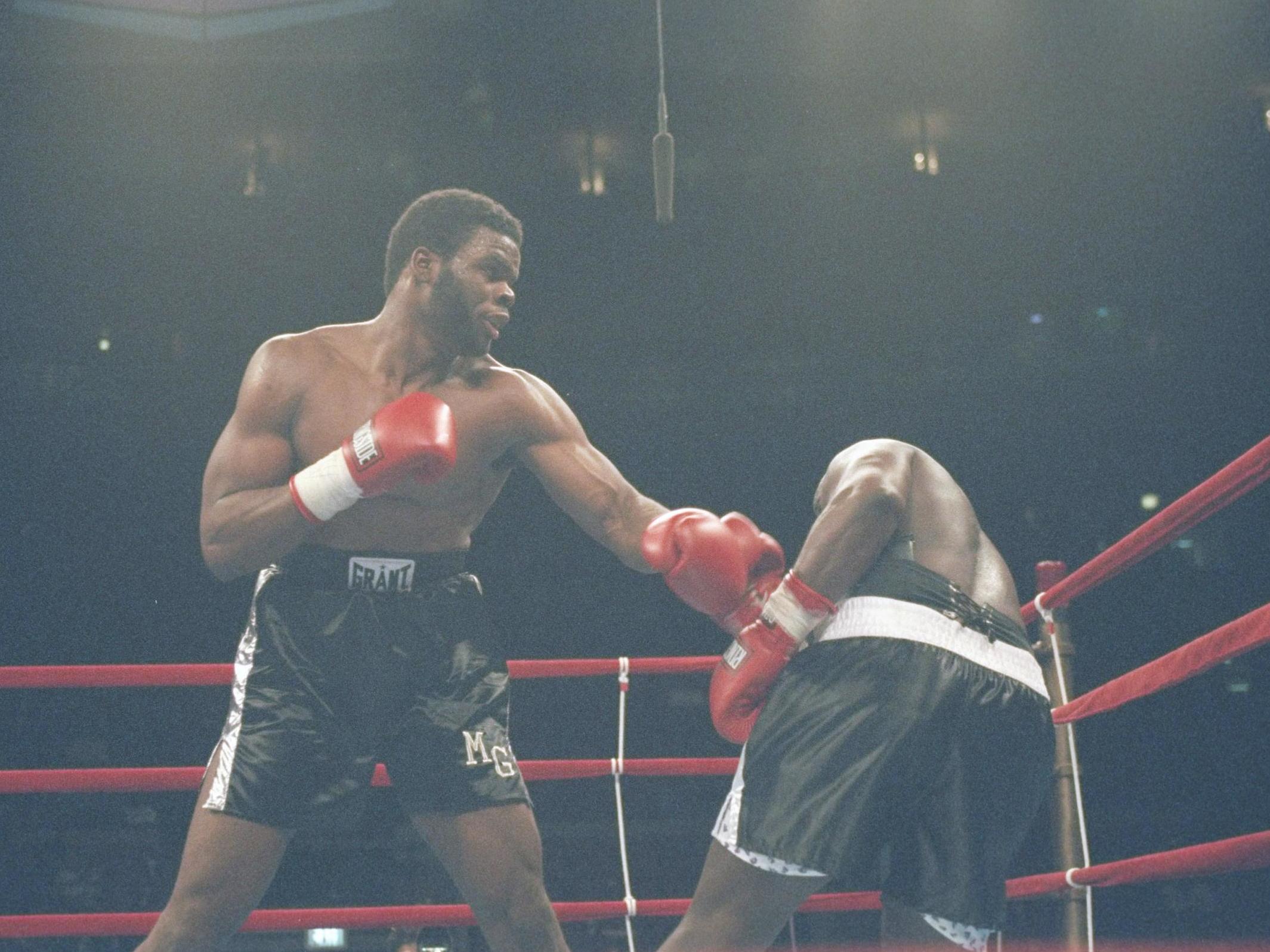 Bradley Rone (r) is punched by Michael Grant