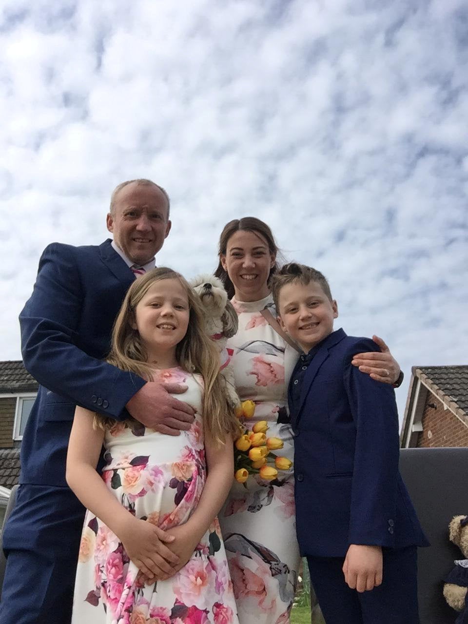 The family of four pictured on the big day.