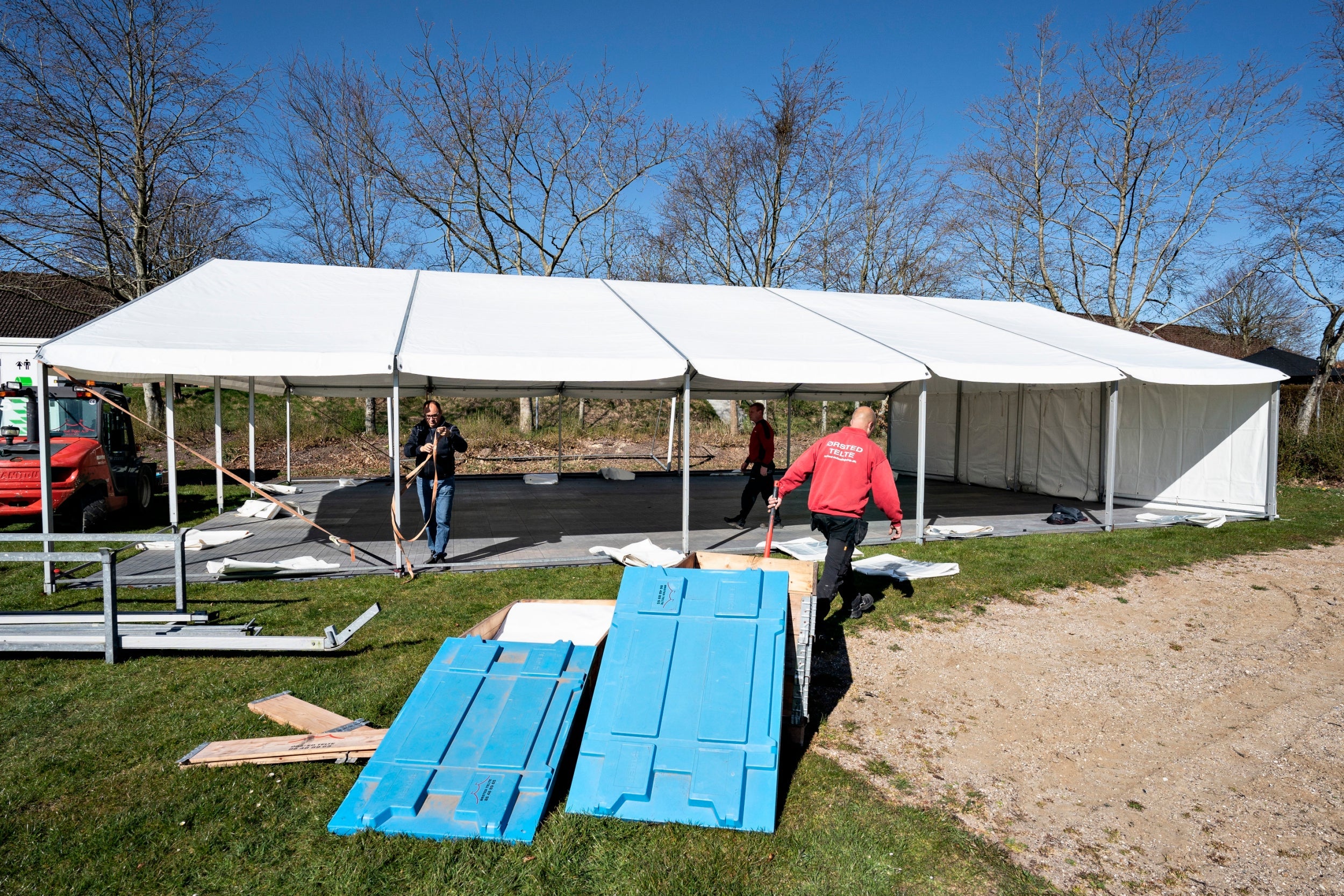 A tent and toilet wagon are delievered to a school in Stoevring, Denmark as classes are run outside