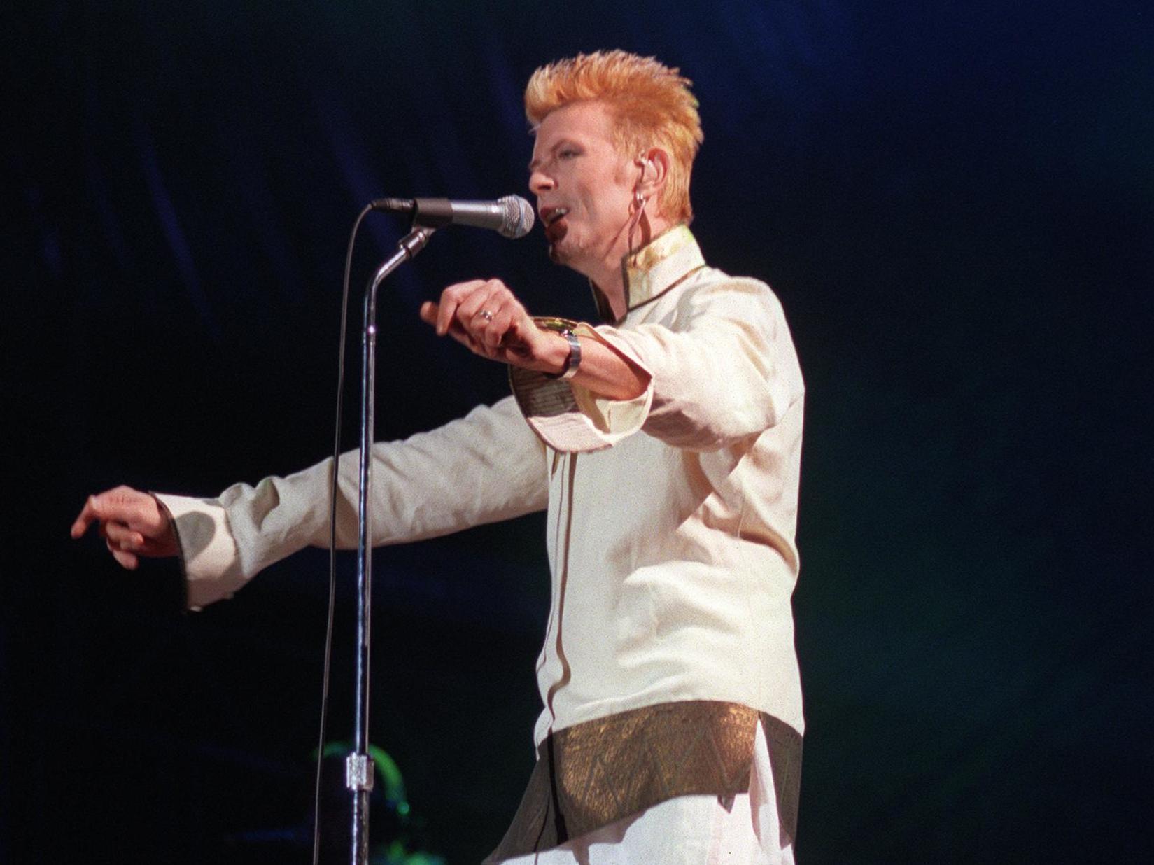 Ziggy gets jiggy: Bowie performs on stage at the Parc des Princes in Paris in 1997 (AFP/Getty)