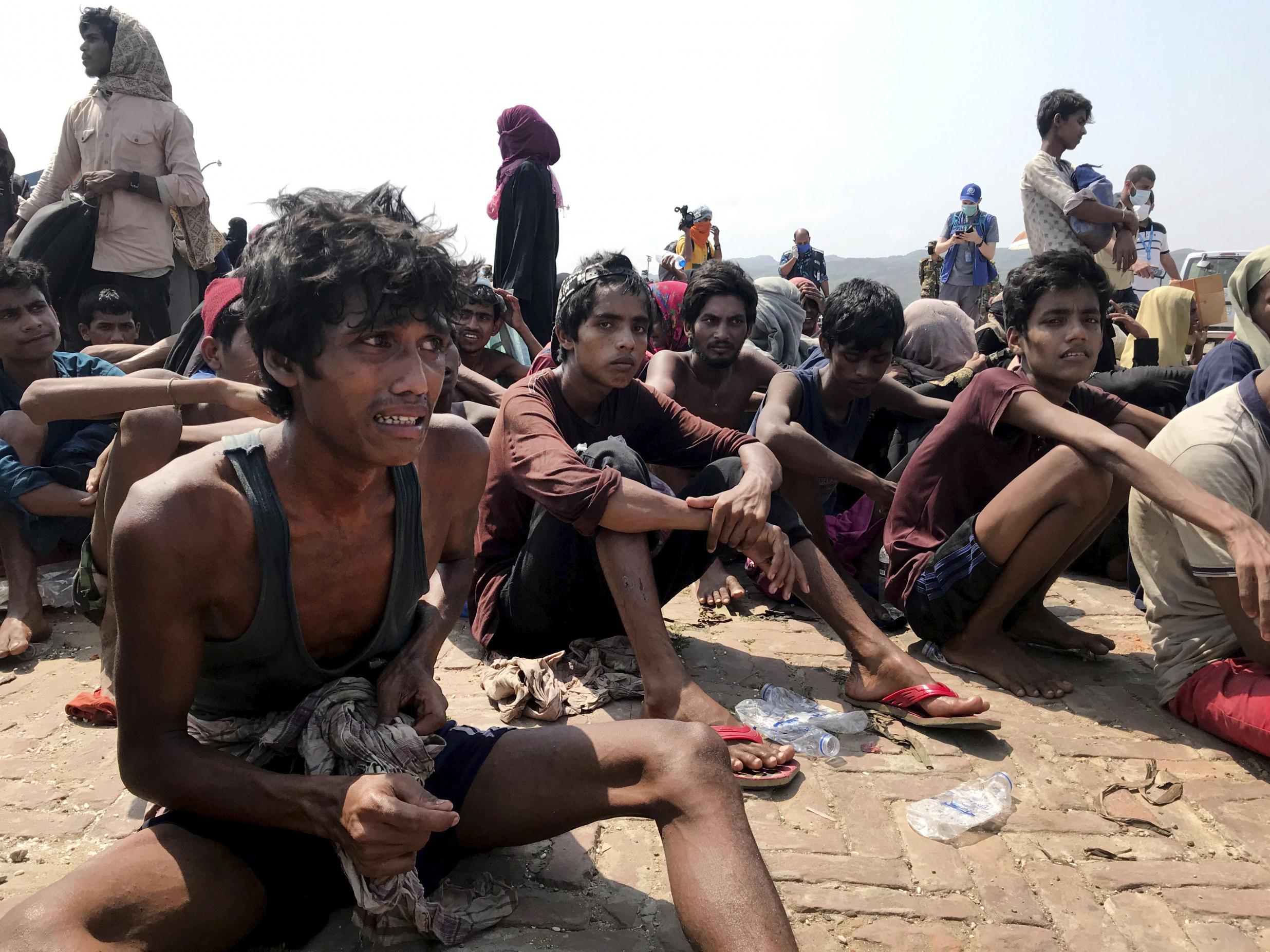 Starving Rohingya refugees after being rescued in Teknaf near Cox’s Bazar after drifting at sea for months