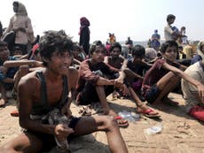 Dozens dead as nearly 400 emaciated Rohingya refugees saved from boat adrift for two months off Bangladesh