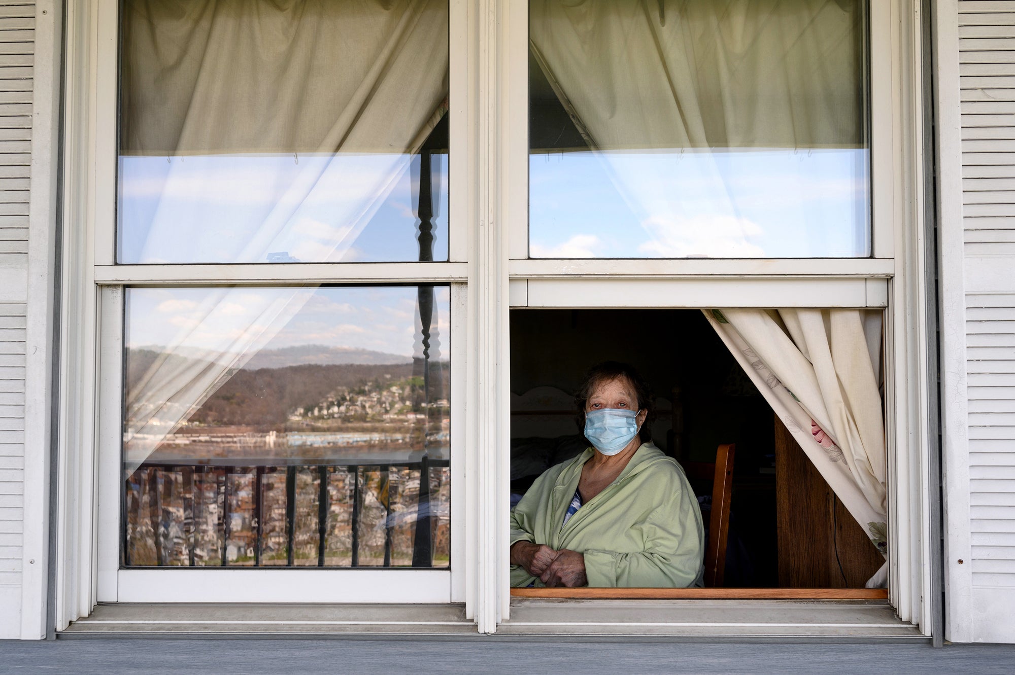 Billie Namath looks out of the window of her daughter’s home