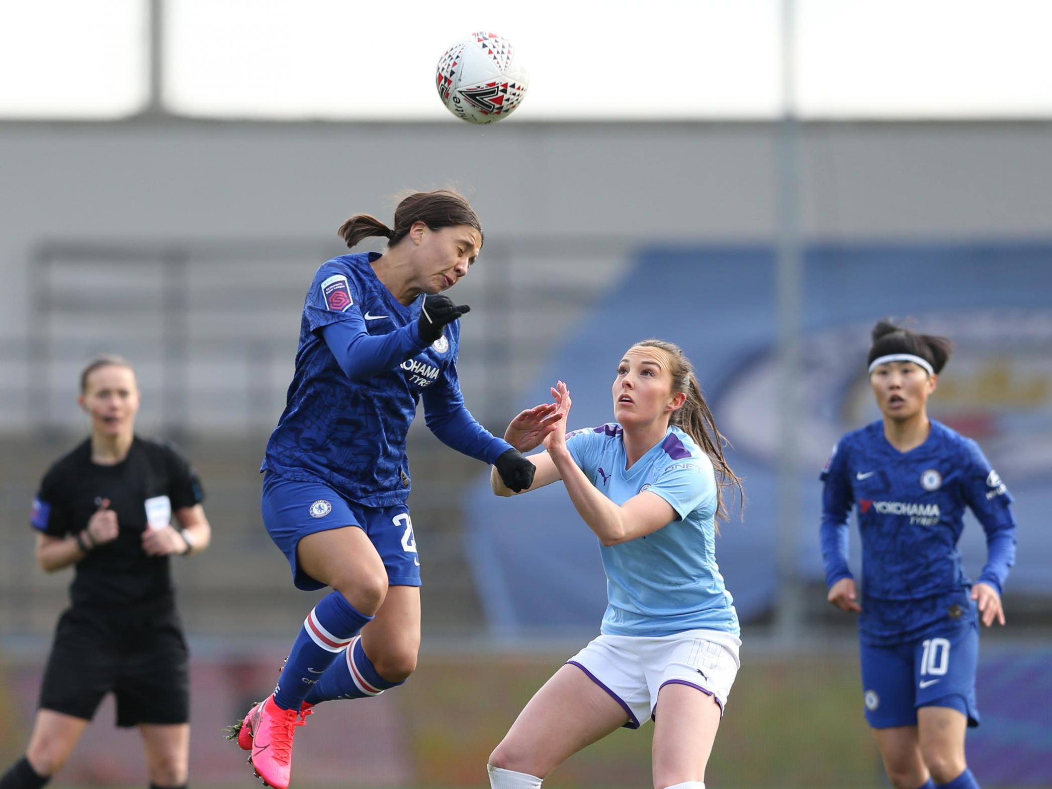 Sam Kerr wins a header against Manchester City