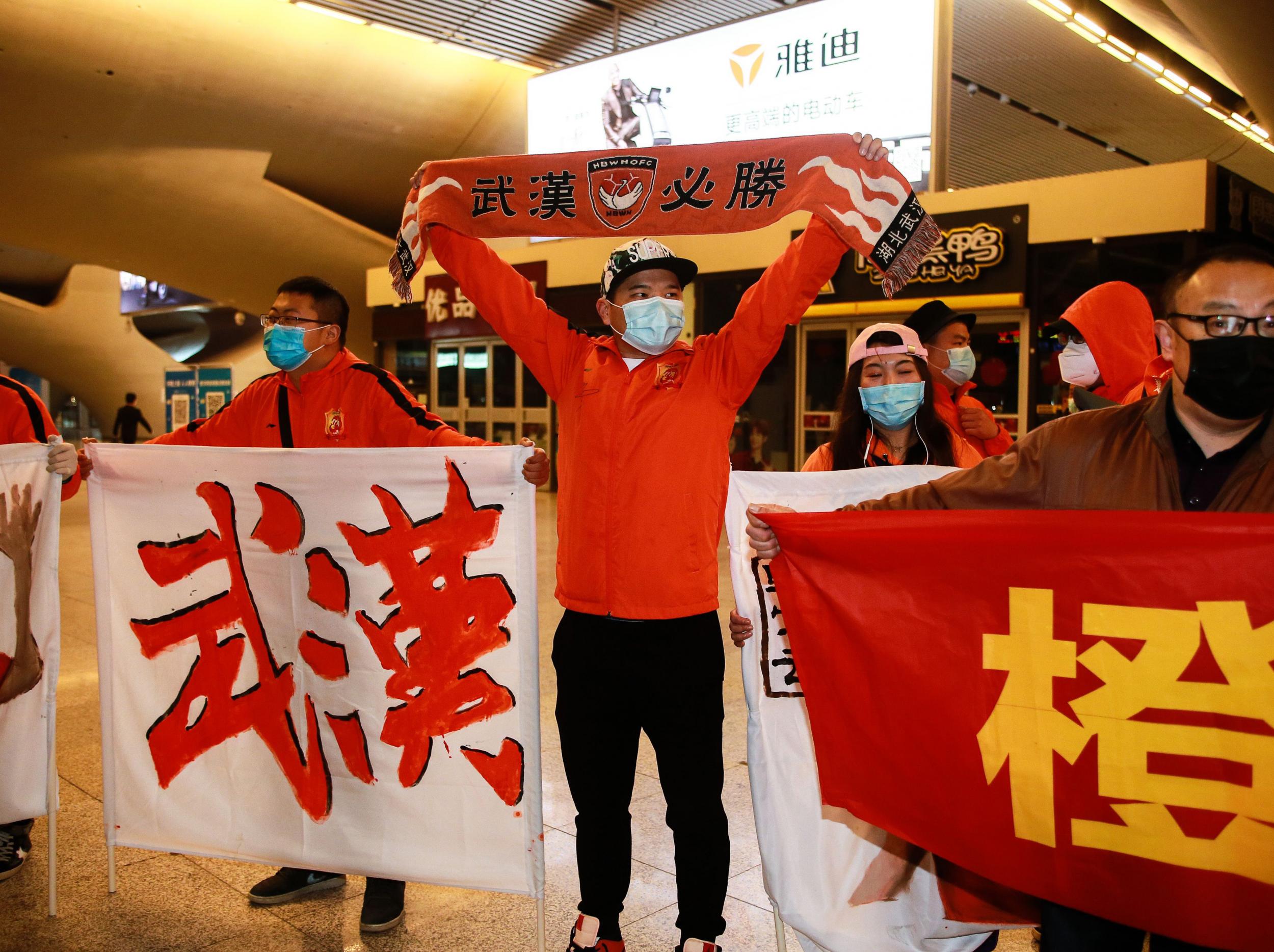 Fans of Wuhan Zall welcome their team home