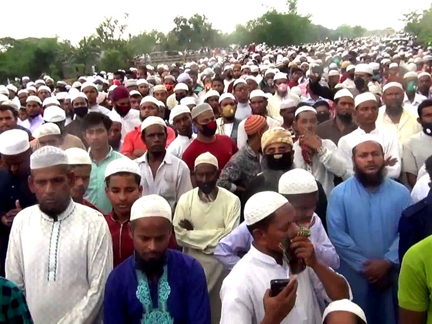 Tens of thousands of Bangladeshi Muslims gather to attend the funeral of a popular Islamic preacher, defying a nationwide lockdown to curb the spread of the coronavirus