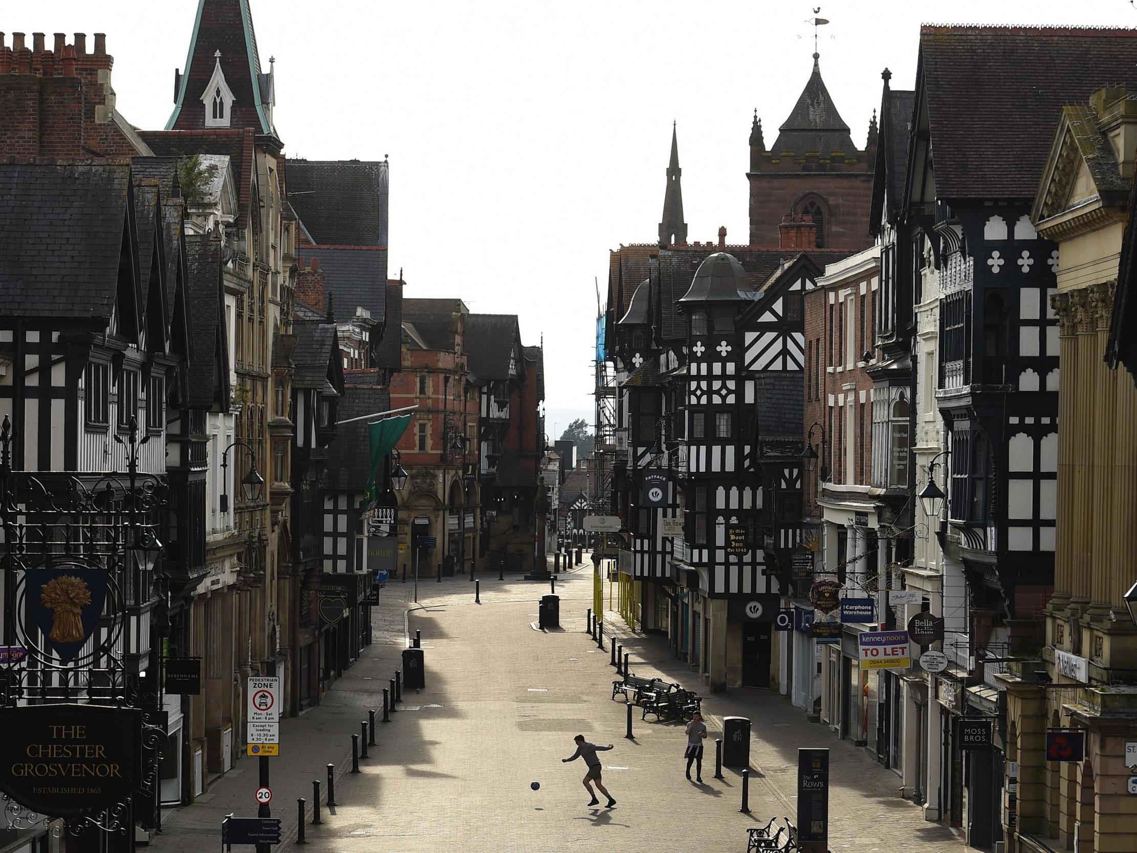 Despite the UK’s recent sunny weather, cities like Chester have remained deserted (AFP)