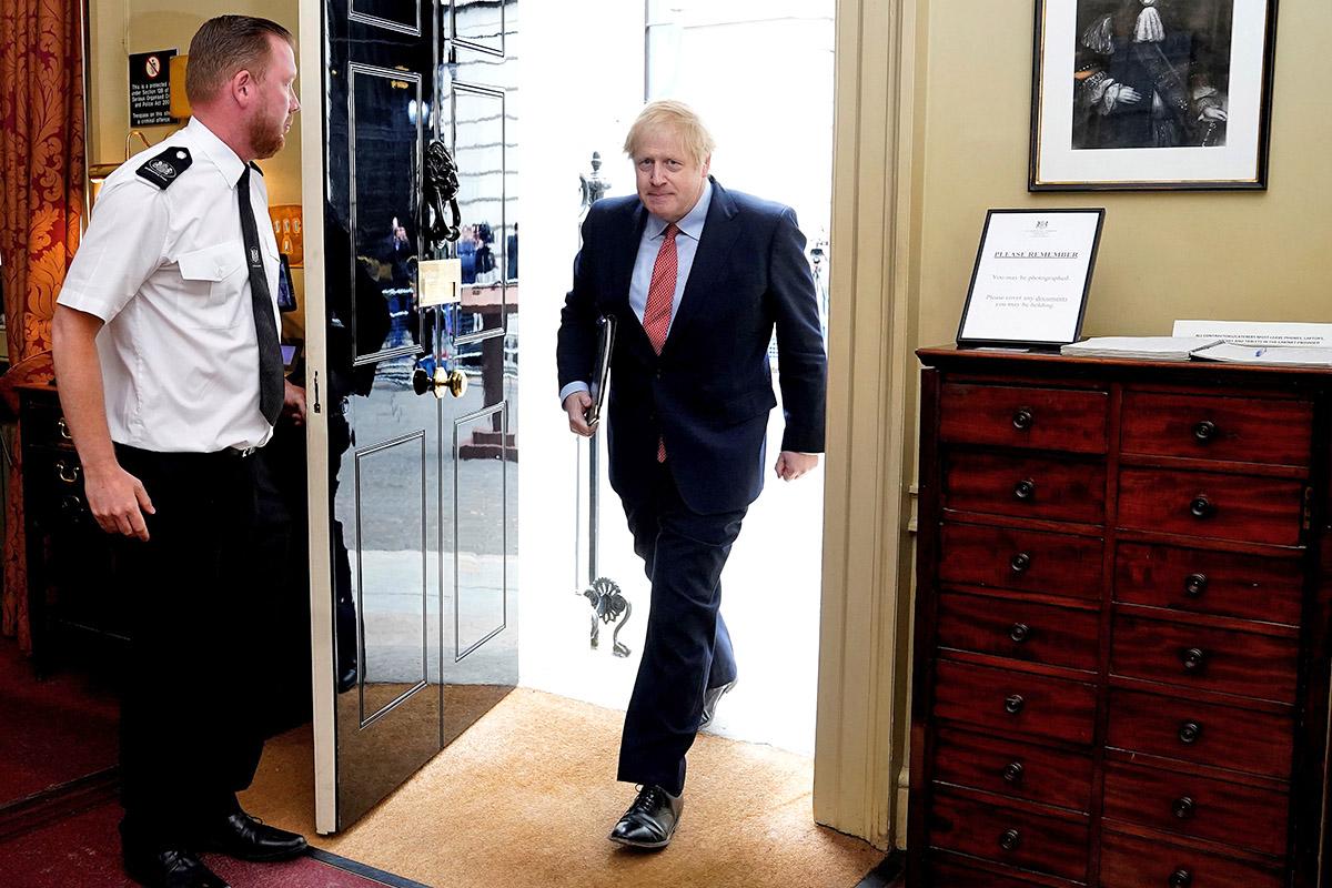 Boris Johnson said Covid-19 must be ‘wrestled to the ground’ (10 Downing Street/AFP/Getty)