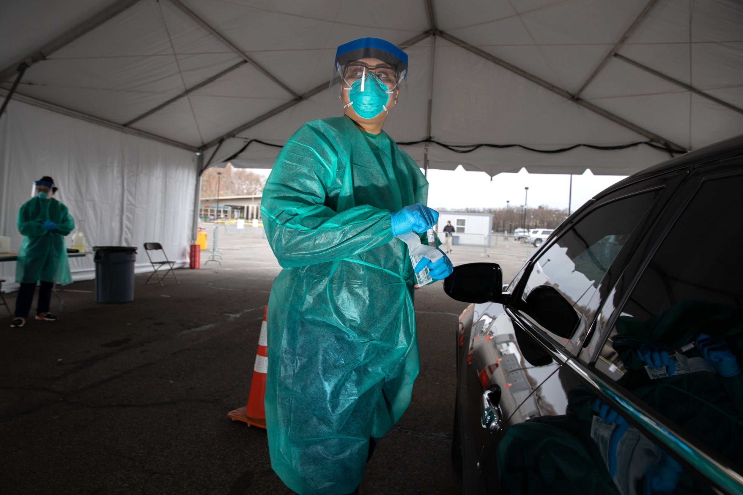 A doctor and patient at a drive-through testing centre in the Bronx, New York City