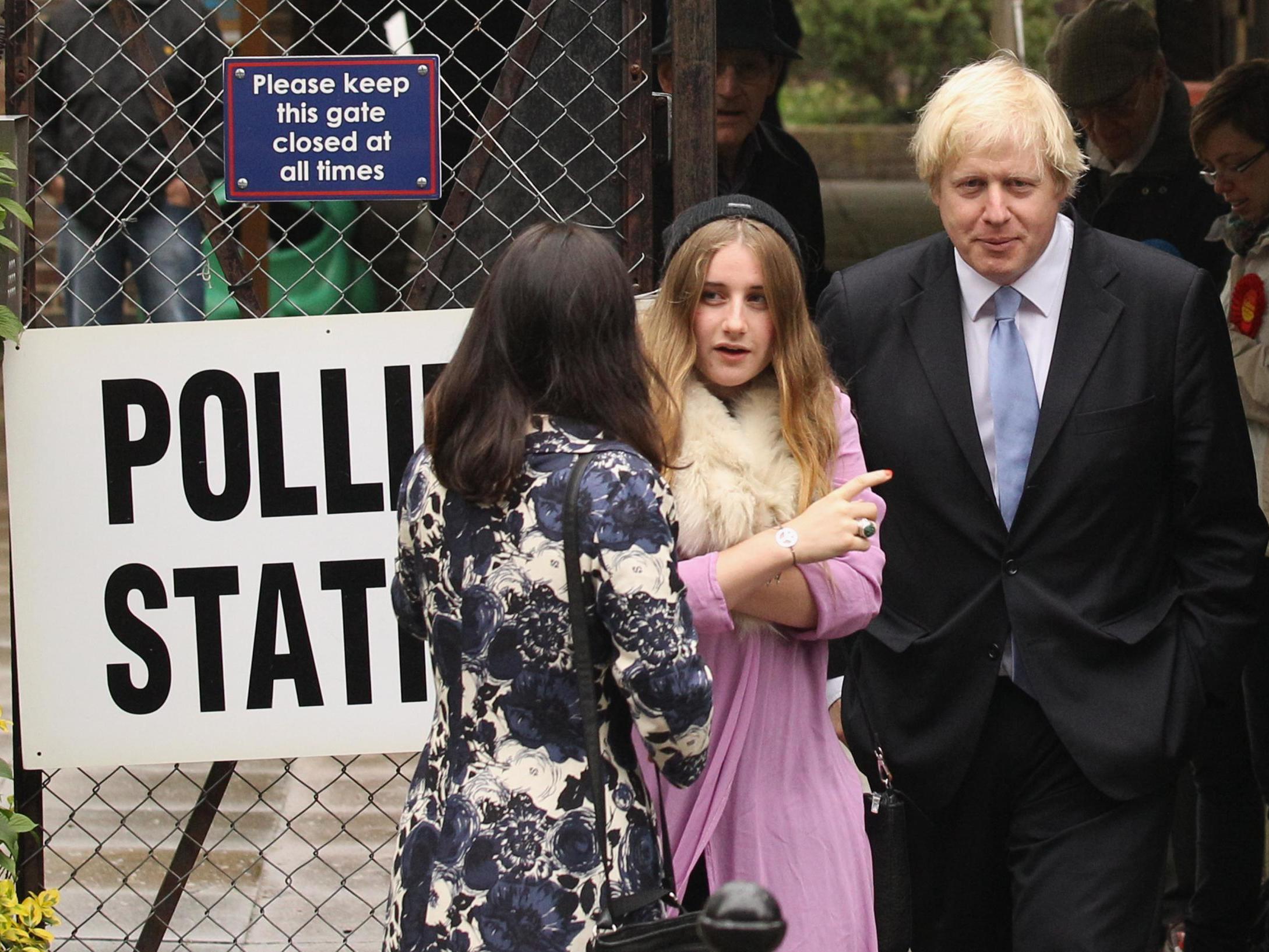 Boris Johnson pictured with his daughter Lara Johnson at a polling station after casting their votes in the election for the next Mayor of London in 2012 (G