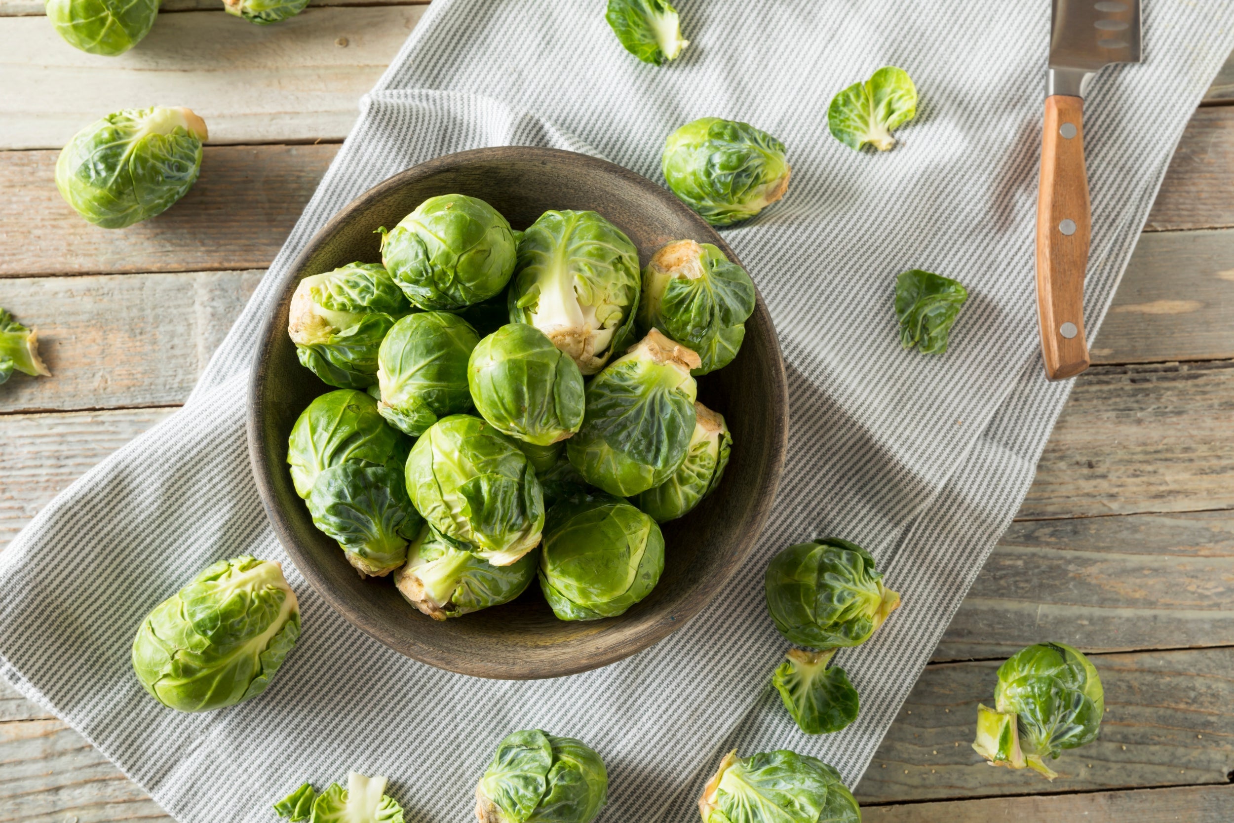 A bowl of raw Brussels sprouts