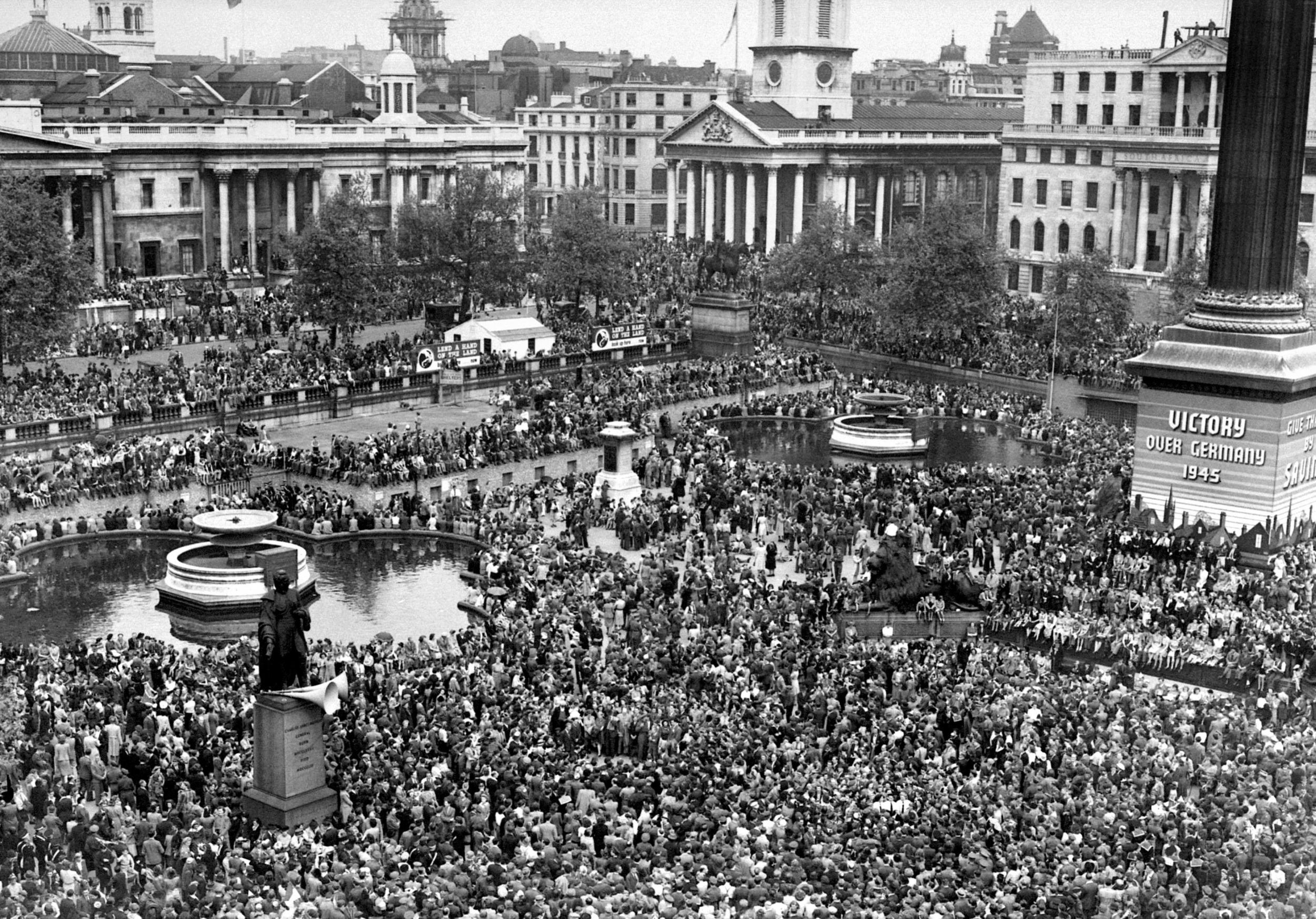 Crowds gather in London's Trafalgar Square to celebrate the end of the Second World War, 8 May 1945