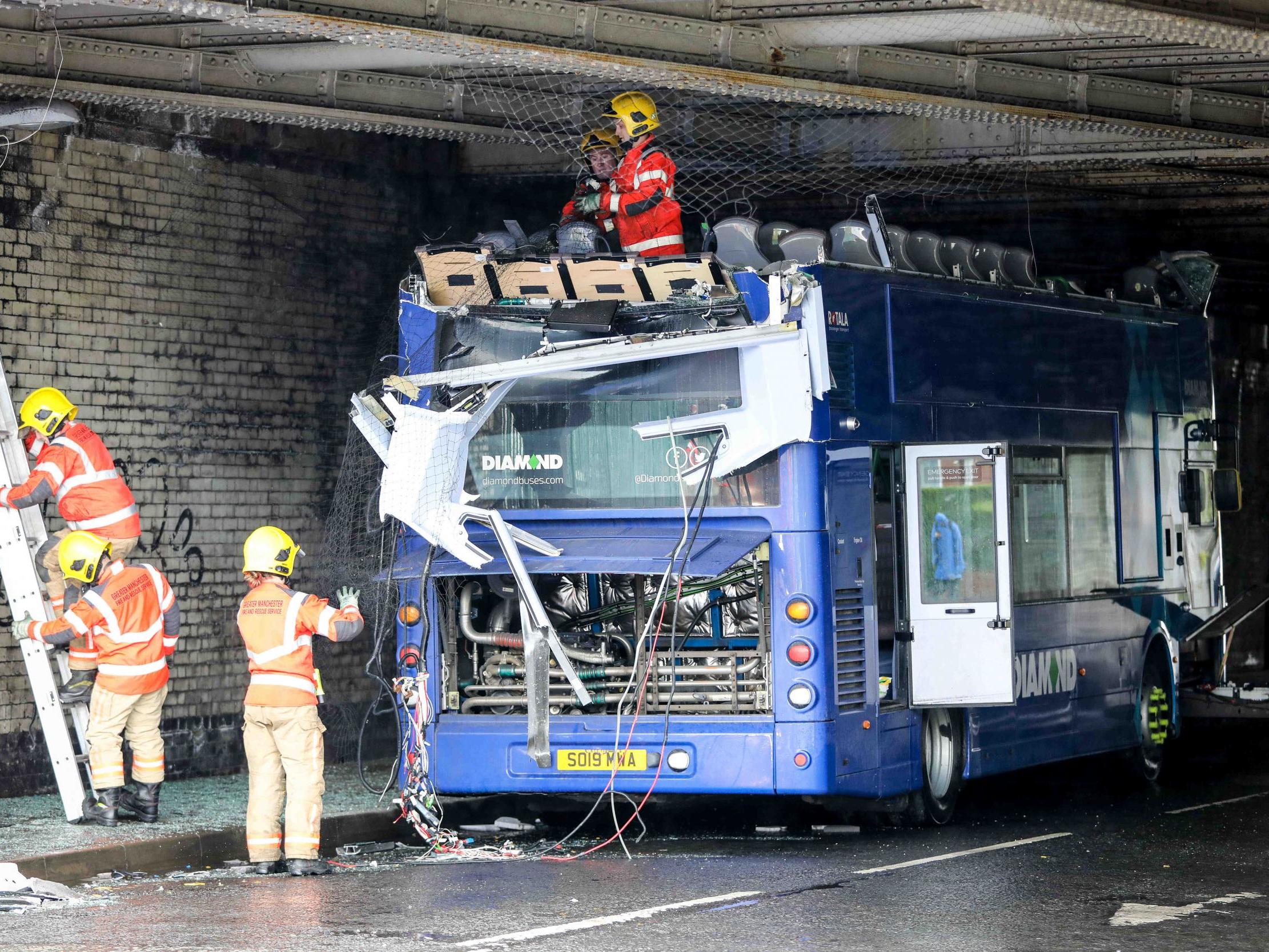 The roof of the bus was shorn off by the bridge