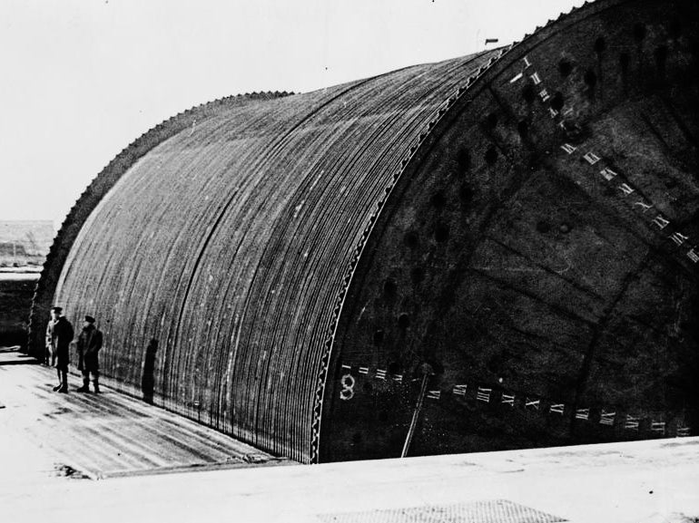 A ‘Conundrum’ loaded with sub-sea pipeline, created as part of Operation Pluto, ready to be towed across the Channel