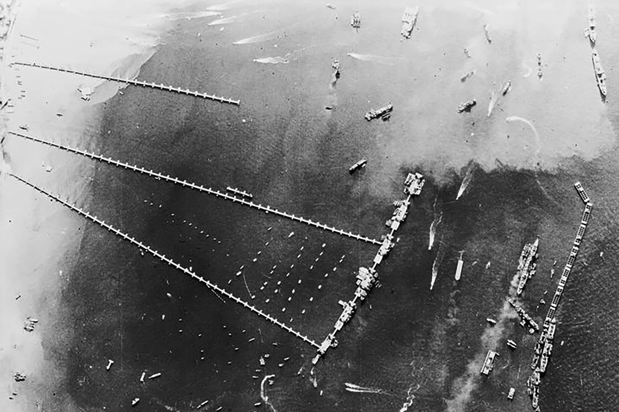 An aerial view of the pierhead and breakwater at the artificial Mulberry harbour at Arromanches